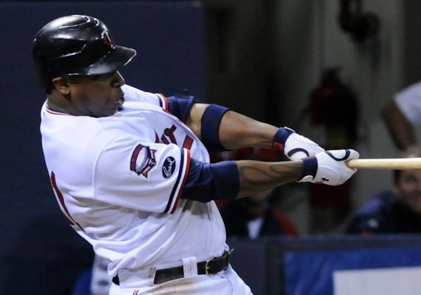 Minnesota Twins' Delmon Young delivers a three-run double off Kansas City Royals' Zack Greinke in the sixth inning of a baseball game Saturday, Oct. 3, 2009, in Minneapolis.