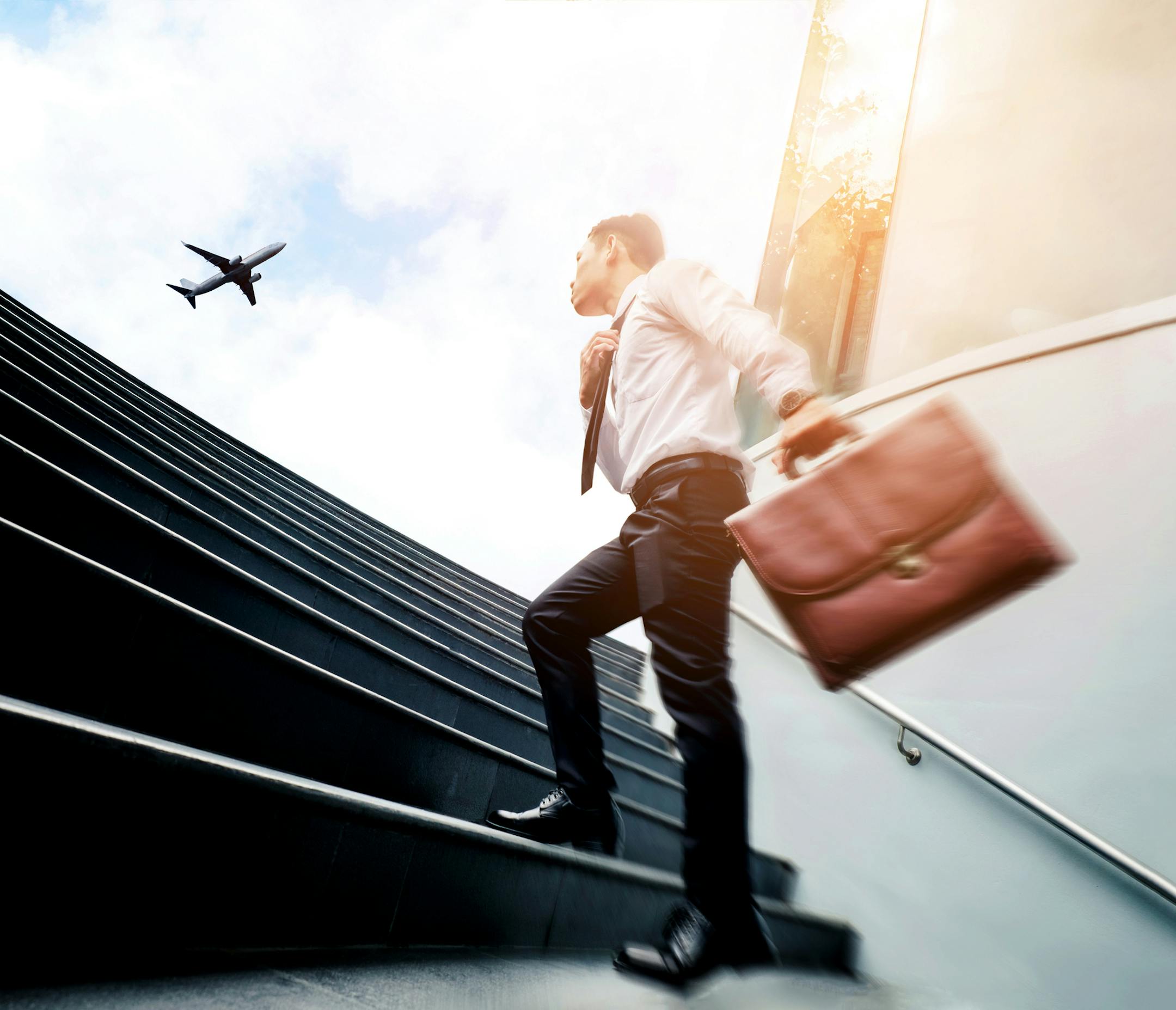 Successful businessman running fast upstairs Success concept