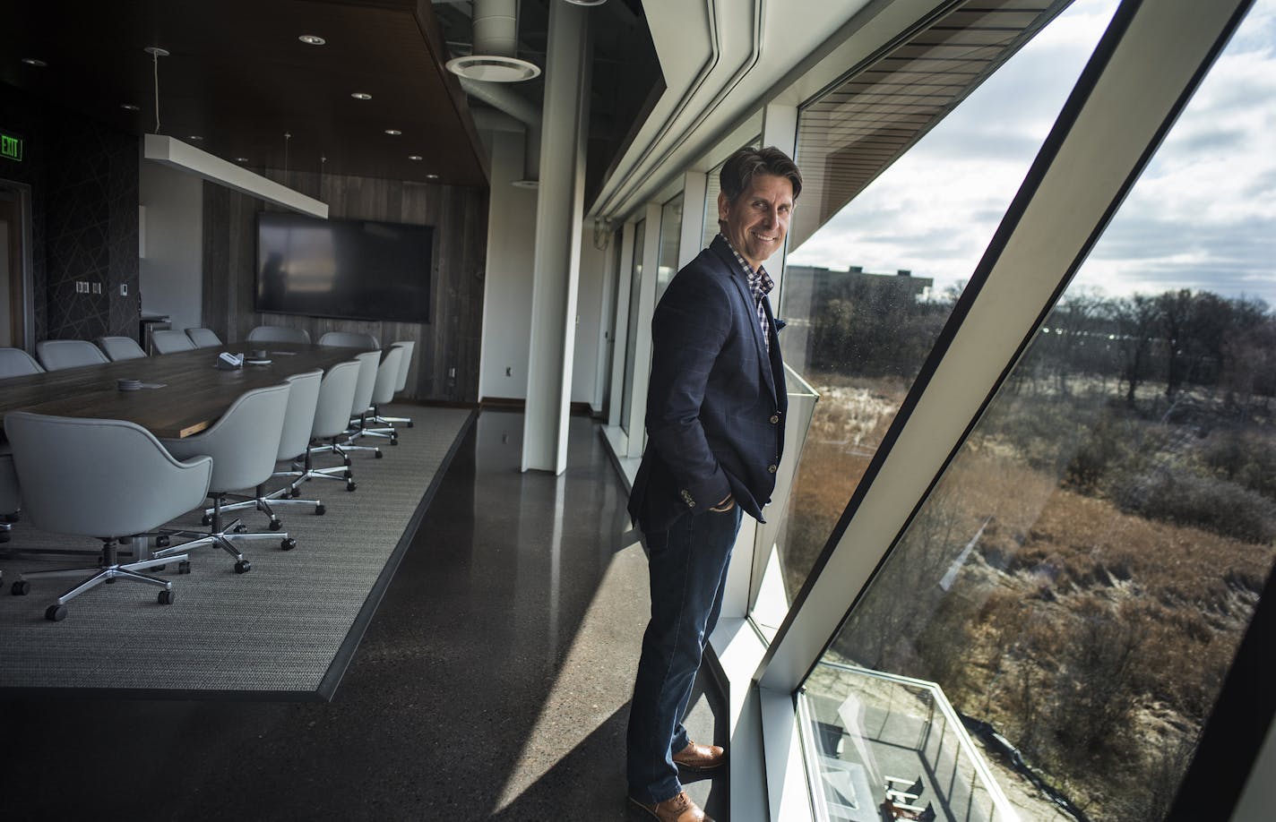 Chuck Runyon, CEO of Anytime Fitness gave a tour of its corporate headquarters which moved from Hastings to Woodbury and has not wasted the opportunity to build something new and unique.The boardroom has an expansive view of the wetlands.] Richard Tsong-Taatarii/rtsong-taatarii@startribune.com