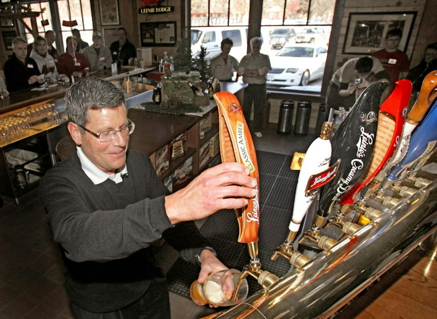 NEW BEER, BIZ, MARYJO BUSCH, 1 OF 2 - Jake Leinenkugel, president of the Jacob Leinenkugel Brewing Company, tapped the first keg of the brewery&#xed;s new year-round beer, Leinenkugel&#xed;s Classic Amber, Monday, 2/2/09, at the Leinie Lodge in Chippewa Falls, Wis. Classic Amber is available only in the Chippewa Valley until mid-February when it will be available in Wisconsin. The beer will rollout nationally in March. photo by MARYJO BUSCHProvided by Leinenkugel -- The two photos of Jake Leinen