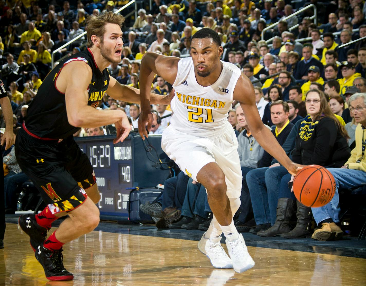 Maryland forward Jake Layman, left, defended against Michigan guard Zak Irvin in the second half of the Wolverines' 70-67 victory over the No. 3 Terrapins at Crisler Center in Ann Arbor, Mich., on Tuesday.