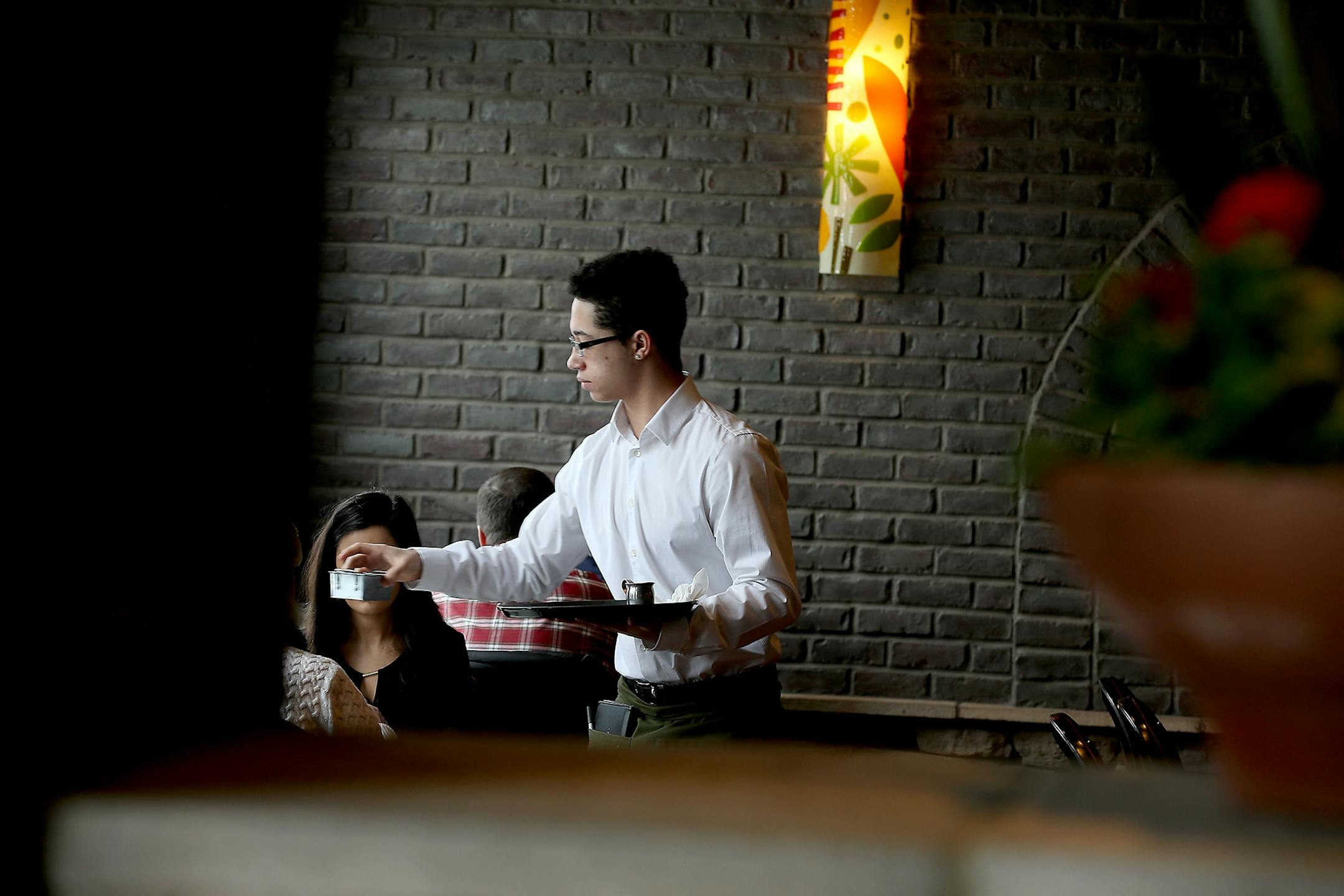 Waiter Kenneth Daniels waited on tables at Vivo, Monday, February 16, 2015 in Apple Valley, MN.