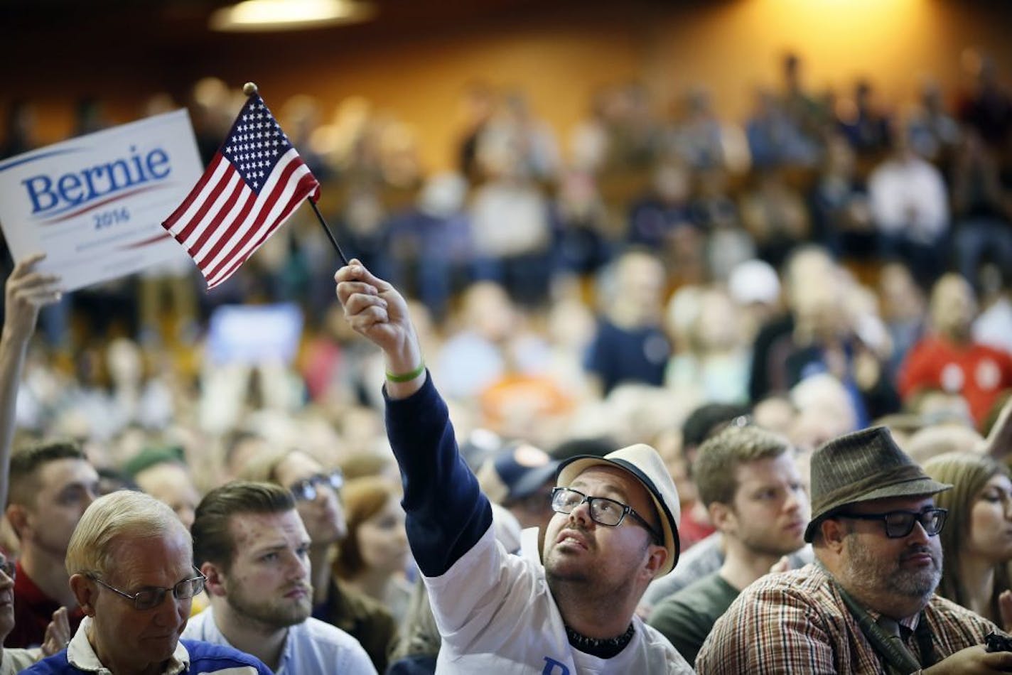 Christopher Krauss of Rochester waved an American flag during a rally for Sen. Bernie Sanders at the American Indian Center Sunday May 31, 2015 in Minneapolis, MN.