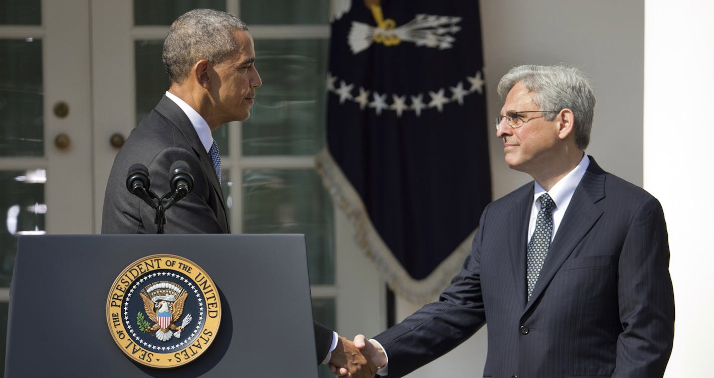 Federal appeals court judge Merrick Garland shakes hands with President Barack Obama as he is introduced as Obama's nominee for the Supreme Court during an announcement in the Rose Garden of the White House, in Washington, Wednesday, March 16, 2016.(AP Photo/Pablo Martinez Monsivais) ORG XMIT: MIN2016031613021039