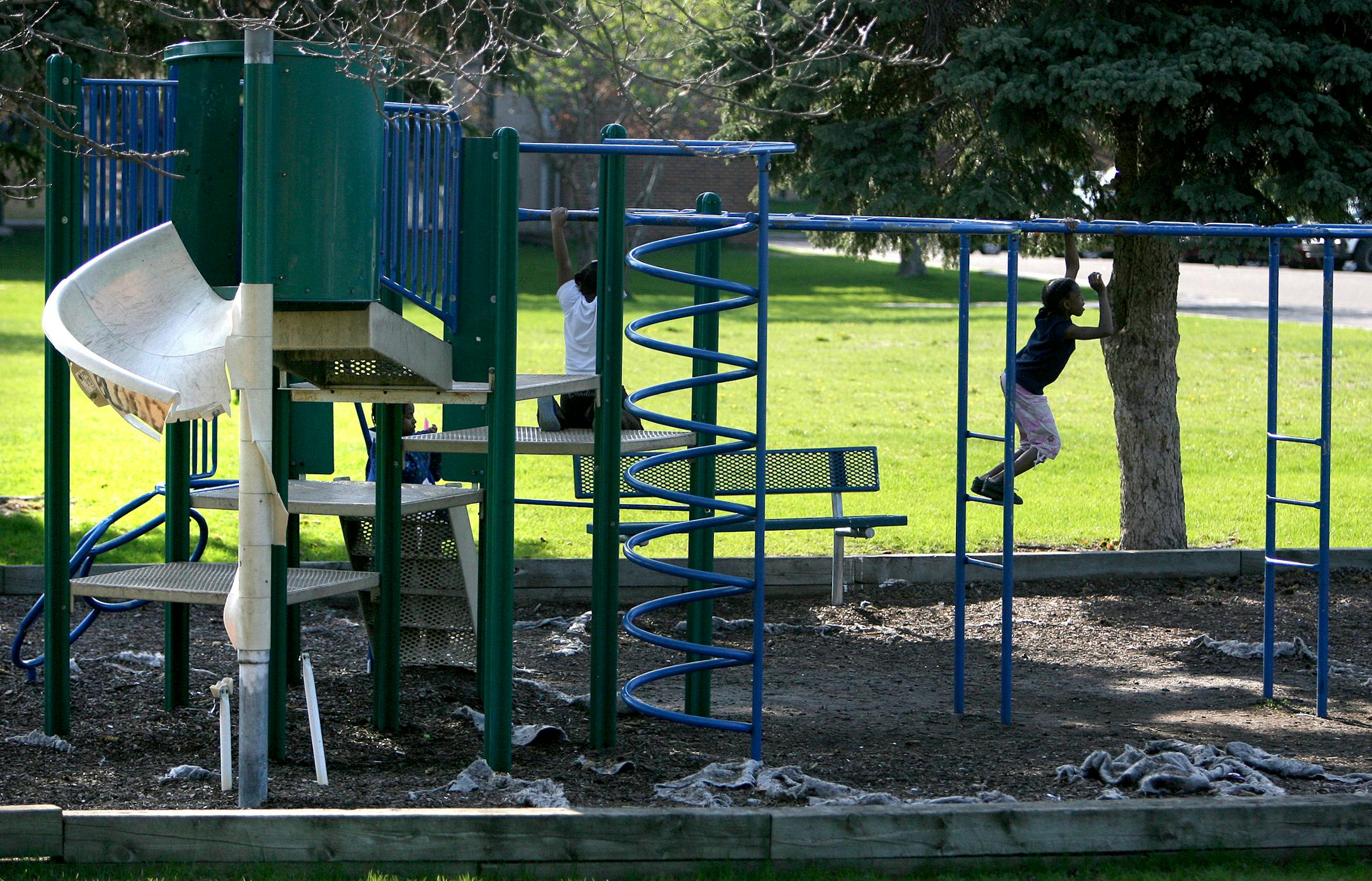 May 7, 2008 - Brooklyn Center, MN -Children played on the Center Pointe apartment complex in Brooklyn Center playground. City officials say North Oaks landlords Hyder and Asgher Jaweed are among the worst property owners they have seen because their large aprtment complexes have fallen into disrepair, including a broken playground, apartments that need repair, and overflowing garbage areas.