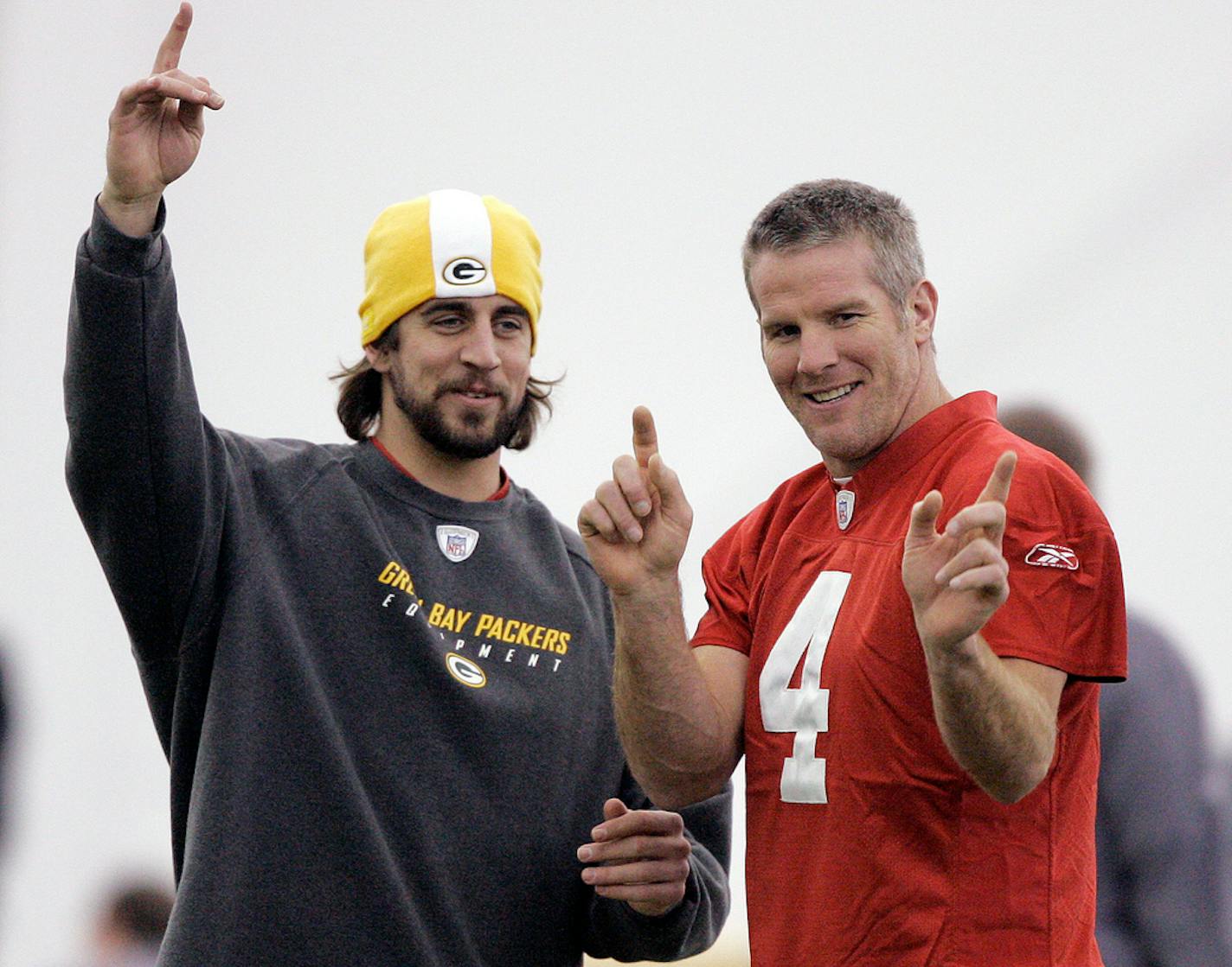 FILE - Green Bay Packers quarterbacks Aaron Rodgers, left, and Brett Favre talk during NFL football practice in Green Bay, Wis., Jan. 16, 2008. The Packers have benefited from three decades of Hall of Fame-caliber quarterback production from Brett Favre and Aaron Rodgers. That's quite the standard for 2020 first-round draft pick Jordan Love to meet. (AP Photo/Morry Gash, File)