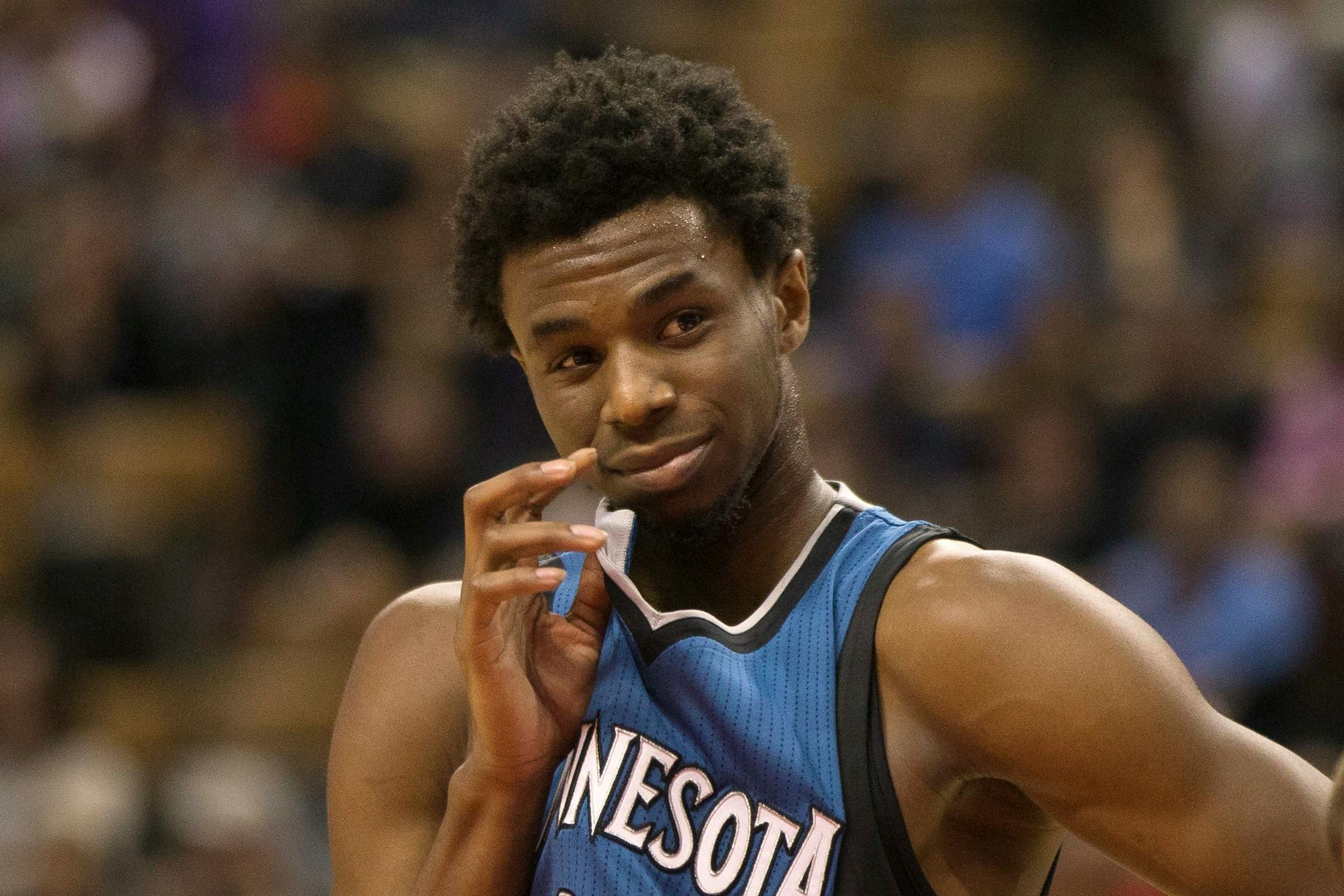 The Timberwolves' Andrew Wiggins gestured to a person in the crowd in Toronto during the first half of an NBA preseason game against the Raptors on Monday.