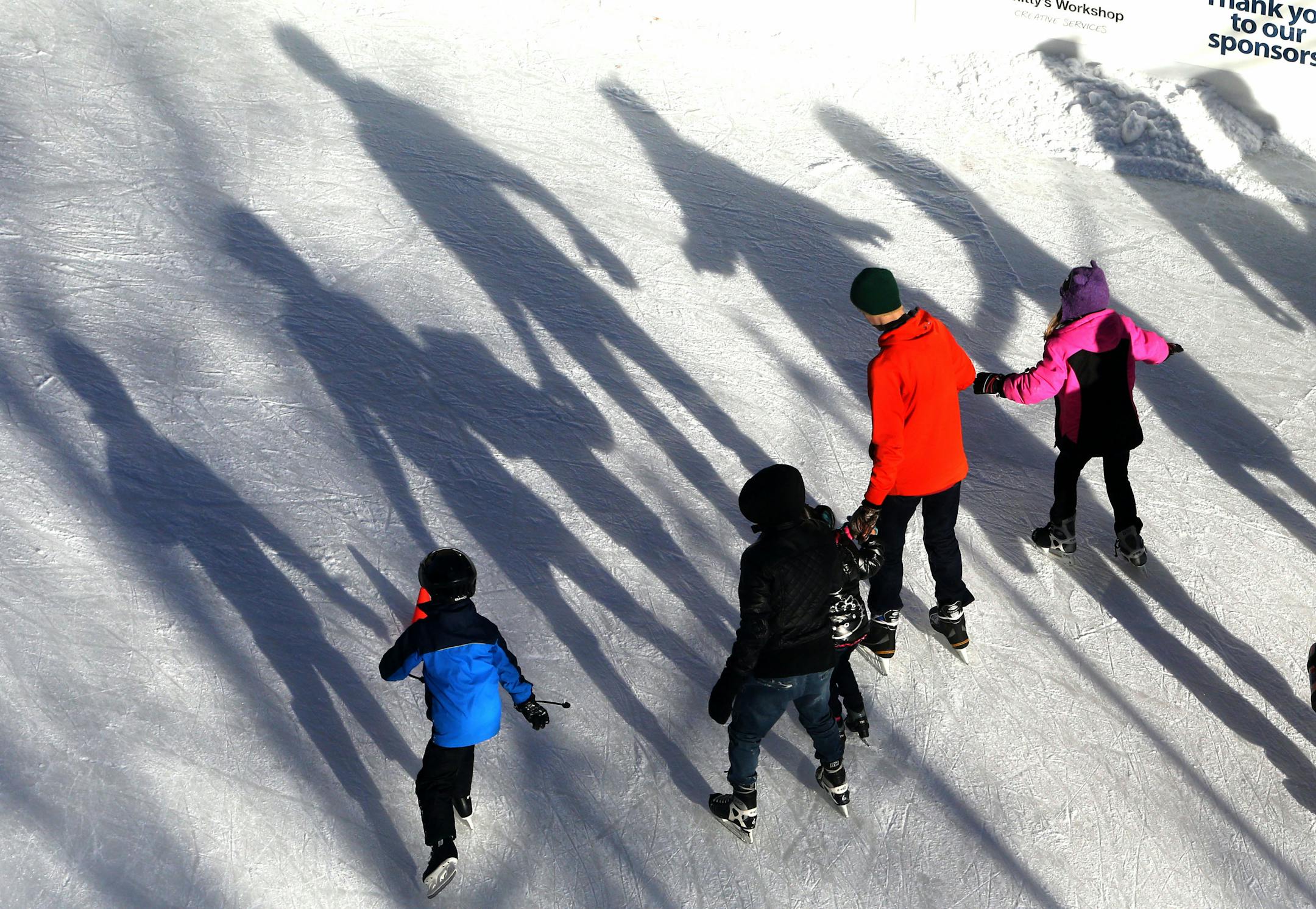 The Wells Fargo WinterSkate rink was a busy one at Rice Park Saturday, Nov 28, 2015. Seen from the Ladmark Center, skaters cast long shadows as the afternoon sun shines bright.](DAVID JOLES/STARTRIBUNE)djoles@startribune.com The Wells Fargo Winter Skate rink at Rice Park
