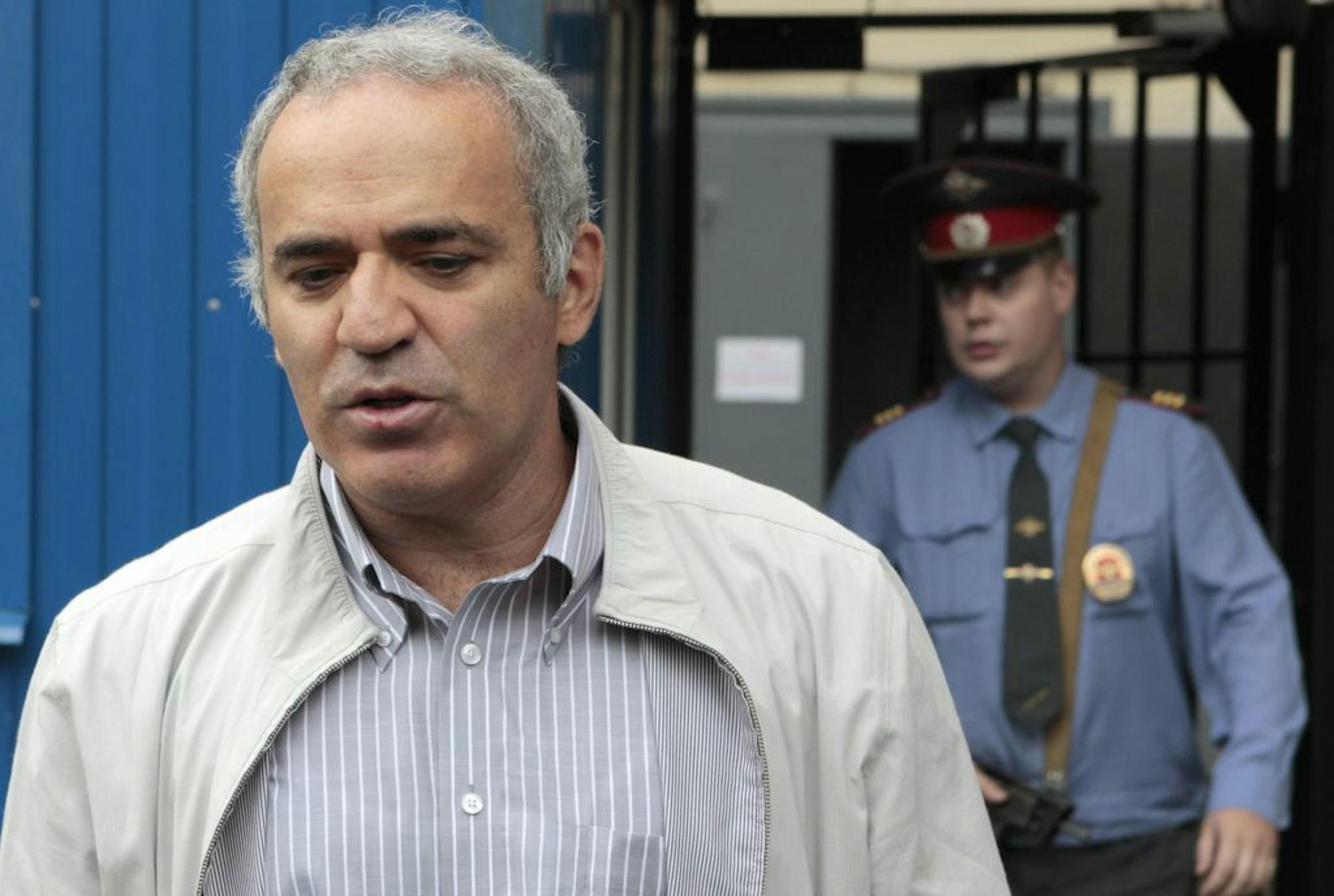 Garry Kasparov, a Russian opposition leader and former world chess champion, speaks to the media after he testified at a police station in Moscow, Russia, Monday, Aug. 20, 2012.