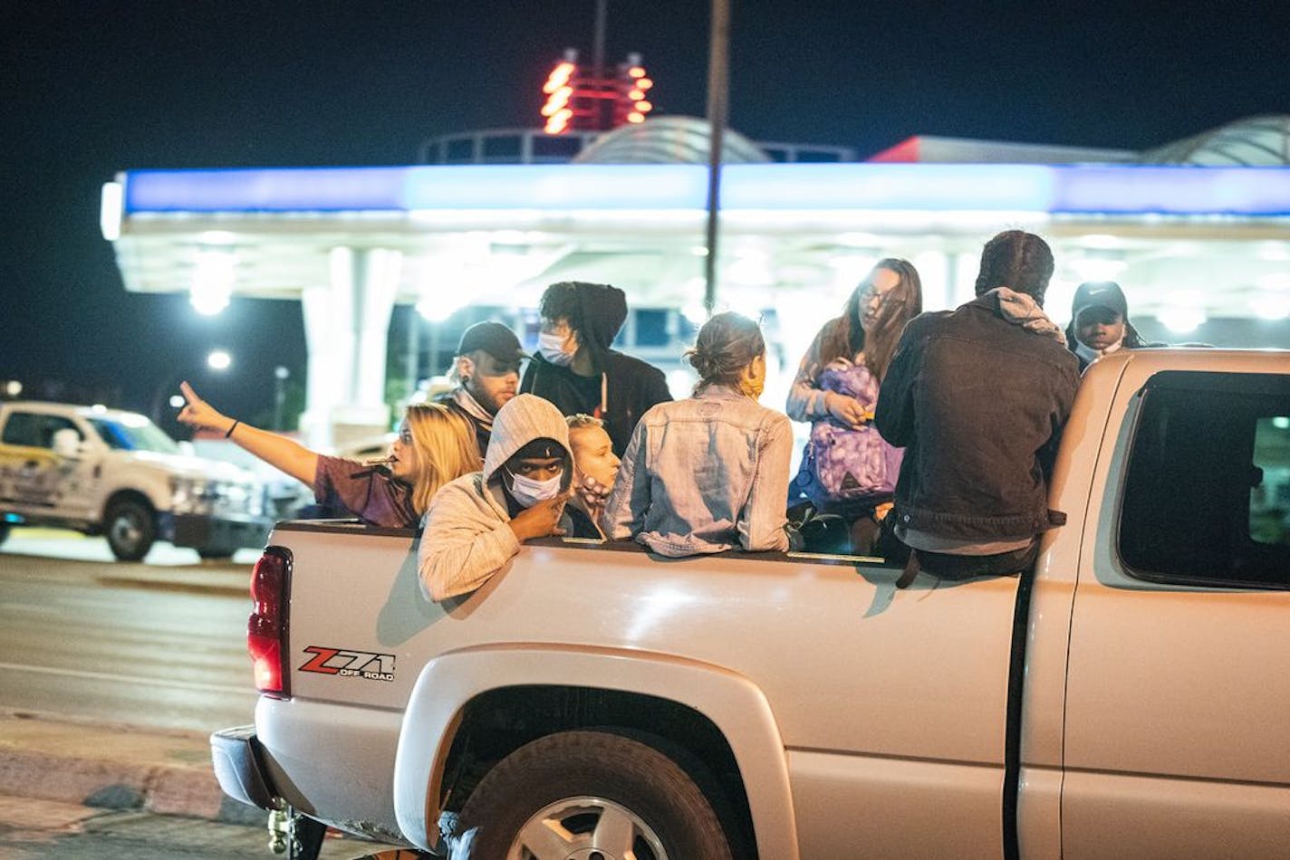 Protesters ride on Washington Avenue in downtown Minneapolis after curfew.