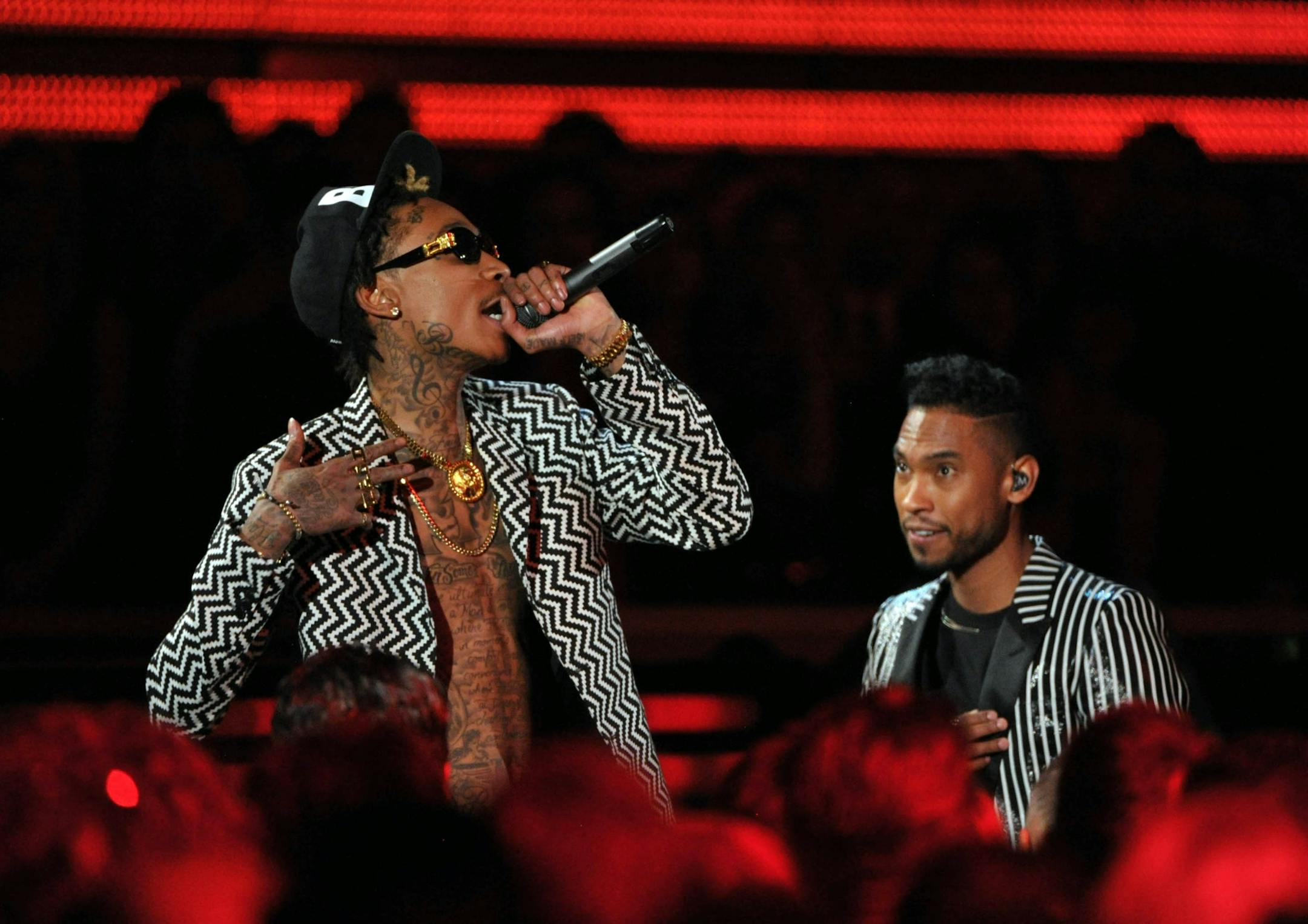 Musicians Wiz Khalifa, left, and Miguel perform at the 55th annual Grammy Awards on Sunday, Feb. 10, 2013, in Los Angeles.