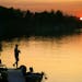 Grabbing a fishing pole at sunset is a cherished part of cabin life.