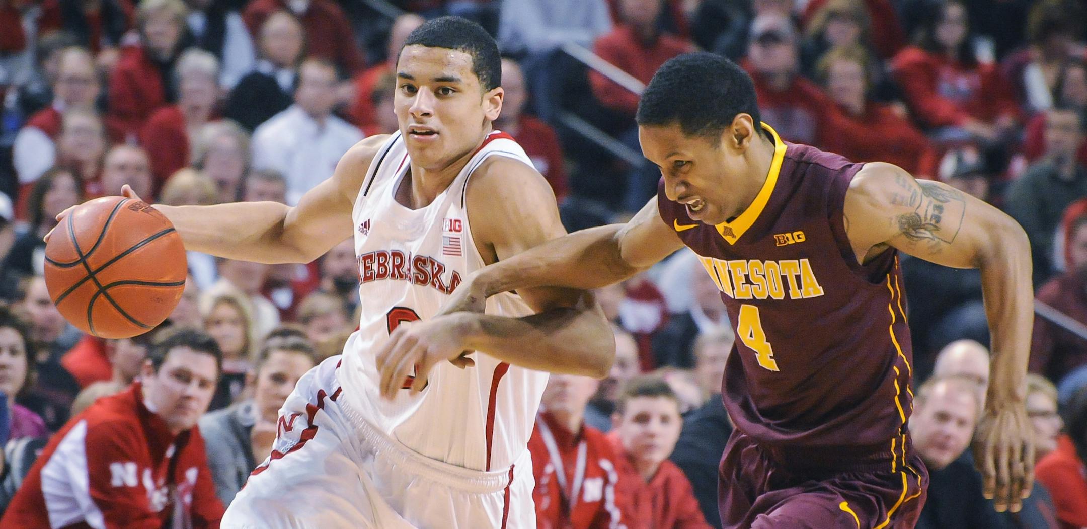 Nebraska Cornhuskers guard Tai Webster (0) drives by Minnesota Golden Gophers guard Deandre Mathieu (4) during their Sunday, Jan 26, 2014 NCAA basketball game at the Pinnacle Bank Arena in Lincoln, Neb. (AP Photo/Dave Weaver)
