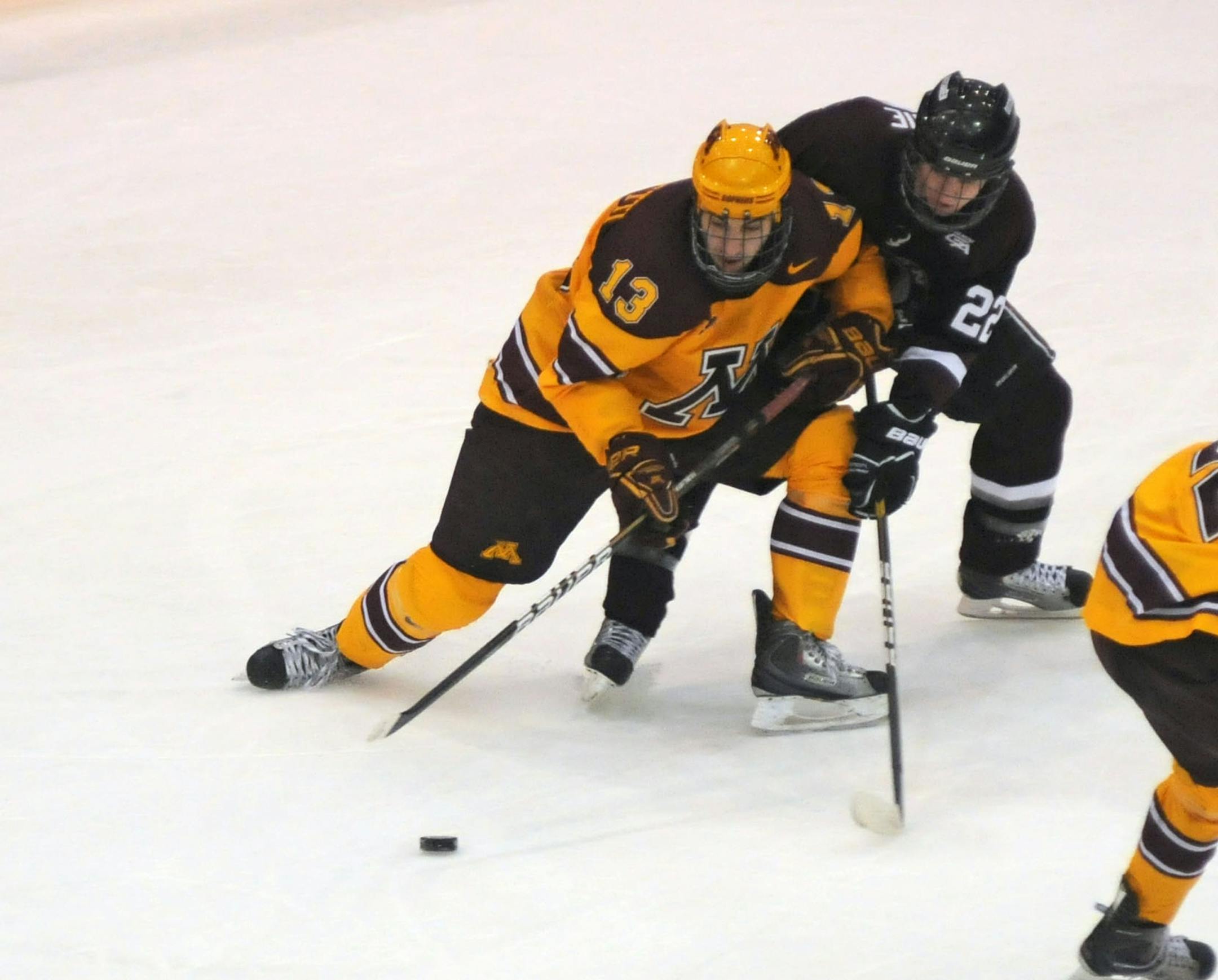 University of Minnesota vs Union College in the Mariucci Classic, at Mariucci Arena.U of M No.13 Nico Sacchetti and Union College No. 22 Mat Bodie joust for the puck in the second period