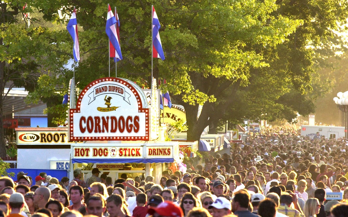 The Iowa State Fair&#x2019;s Grand Concourse flows with people looking for corn dogs and other tasty treats.