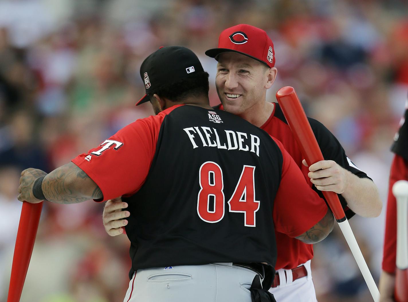 American League's Prince Fielder, of the Texas Rangers, hugs National League's Todd Frazier, of the Cincinnati Reds, during the MLB All-Star baseball Home Run Derby, Monday, July 13, 2015, in Cincinnati.