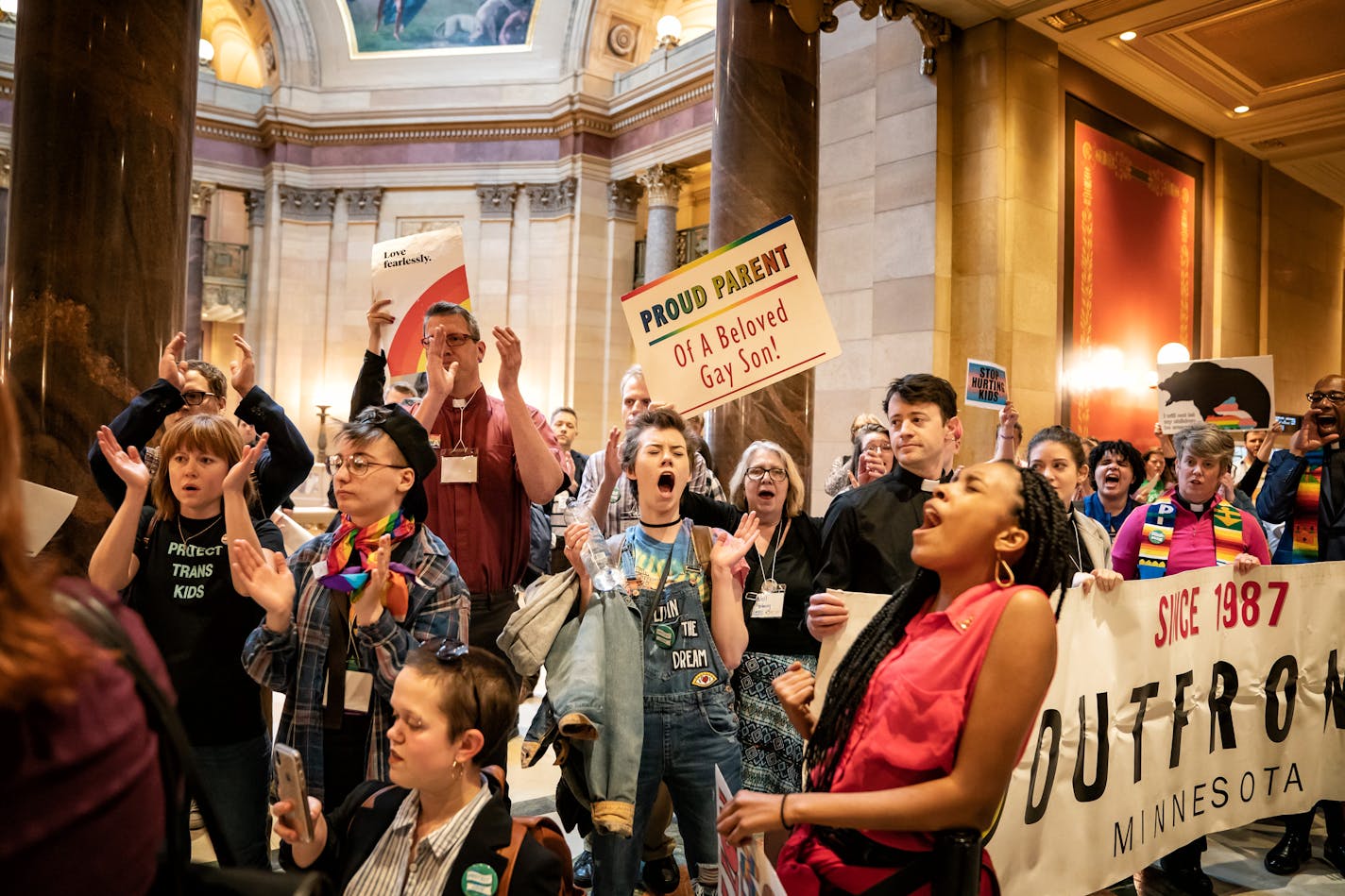 While Rep. Tim Miller, R-Prinsburg, spoke on an amendment about conversion therapy on the House Floor, over one hundred protesters with Outfront Minnesota sang and cheered outside. ] GLEN STUBBE • glen.stubbe@startribune.com Thursday, April 25, 2019