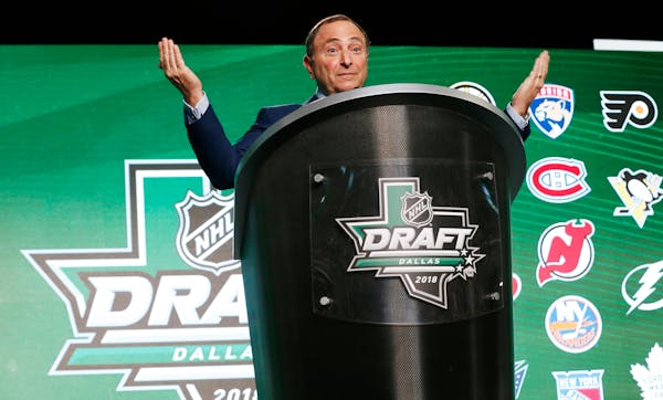 NHL Commissioner Gary Bettman reacts as hockey fans boo him during the NHL hockey draft in Dallas, Friday, June 22, 2018. (AP Photo/Michael Ainsworth)