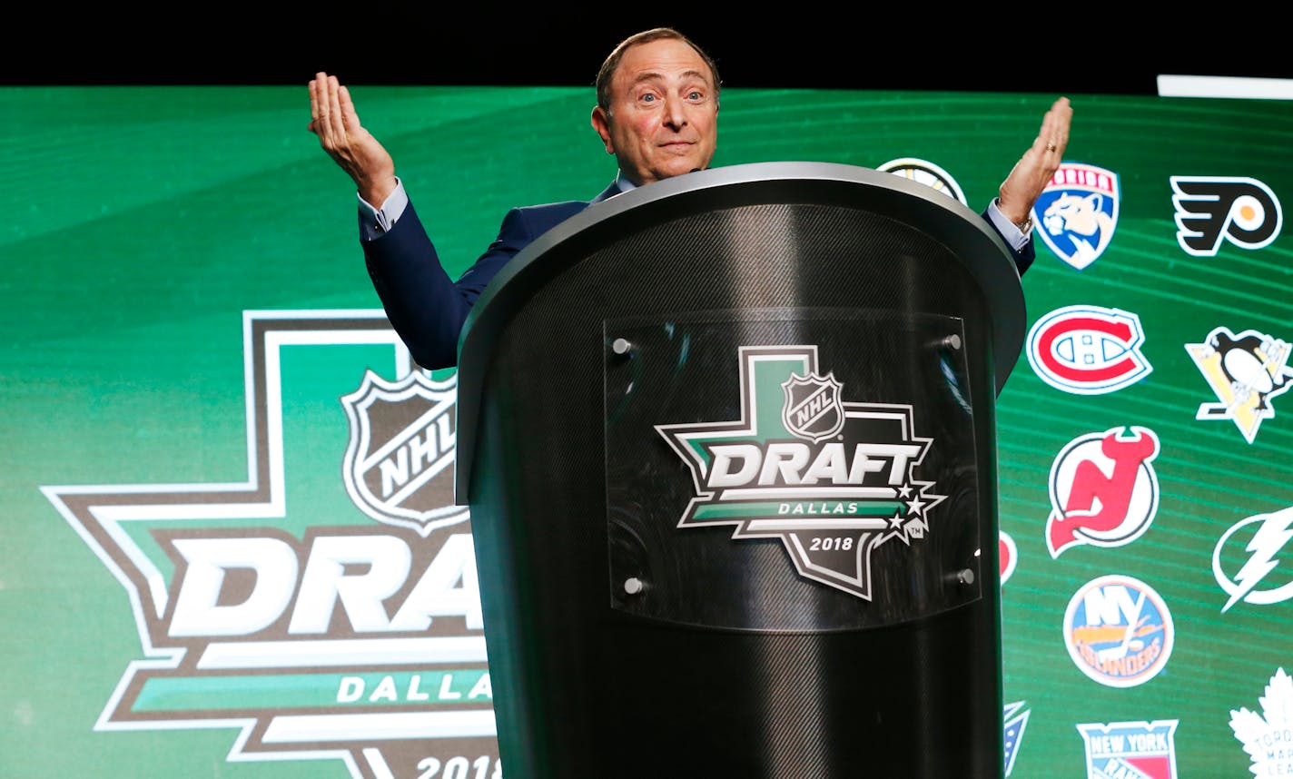 NHL Commissioner Gary Bettman reacts as hockey fans boo him during the NHL hockey draft in Dallas, Friday, June 22, 2018. (AP Photo/Michael Ainsworth)