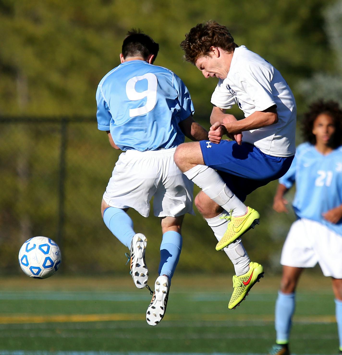 Minnetonka's Peter Stoltenberg and Bloomington Jefferson's Brandon Mundahl battled for the ball in the air. ] (KYNDELL HARKNESS/STAR TRIBUNE) kyndell.harkness@startribune.com Minnetonka vs Bloomington Jefferson for the Boys' Section 2, 2A championship inMinnetonka Min., Tuesday, October 14, 2014.