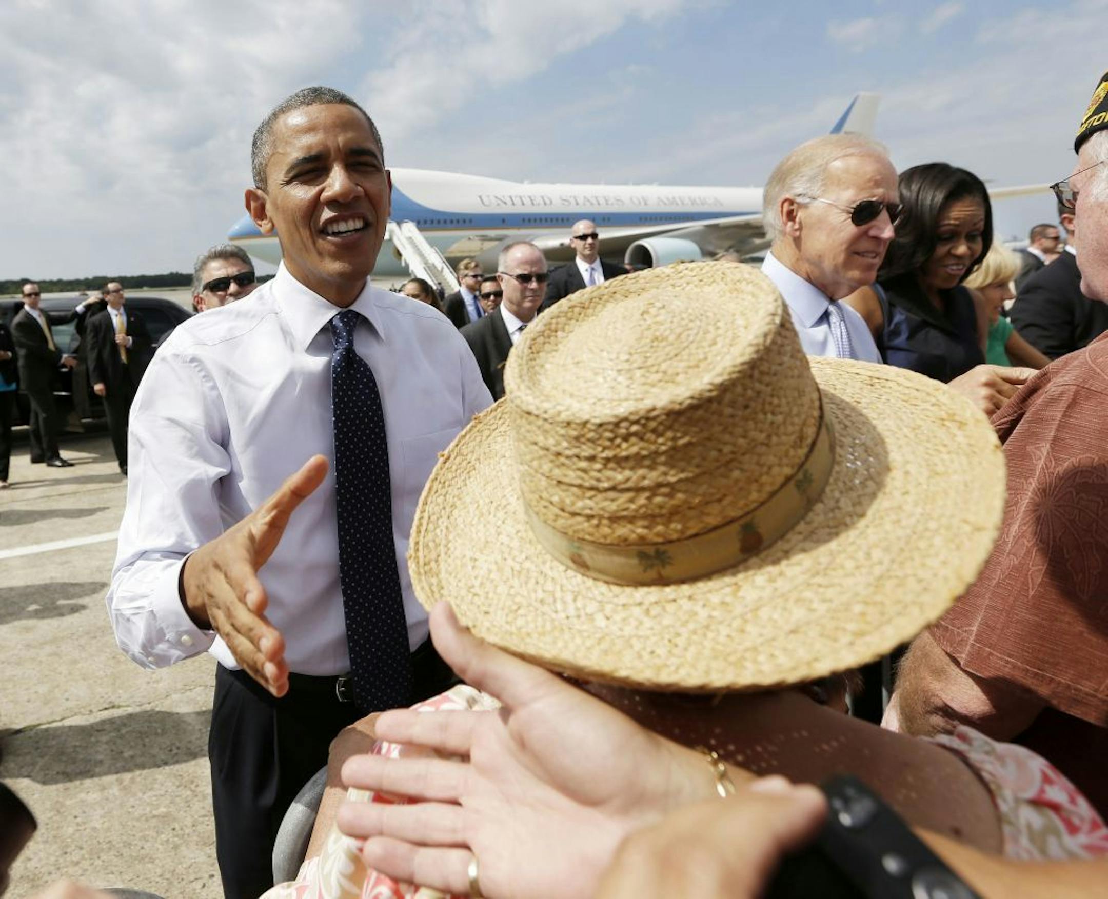 President Barack Obama, Vice President Joe Biden, first lady Michelle Obama and Dr. Jill Biden greet supporters on the tarmac upon their arrival at Portsmouth International Airport at Pease, Friday, Sept. 7, 2012, in Portsmouth, N.H.