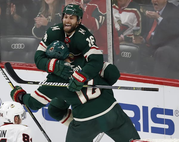 Jason Zucker(16) and Eric Staal(12) celebrate the Wild's first goal. ] the Wild take on the Blackhawks at Xcel Center in St. Paul, Minnesota. Richard 
