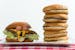 The 1/2 lb. Most American Thickburger from Carl's Jr., left, is comparable in calories to five hamburgers from McDonald's, right. (Lezlie Sterling/Sac
