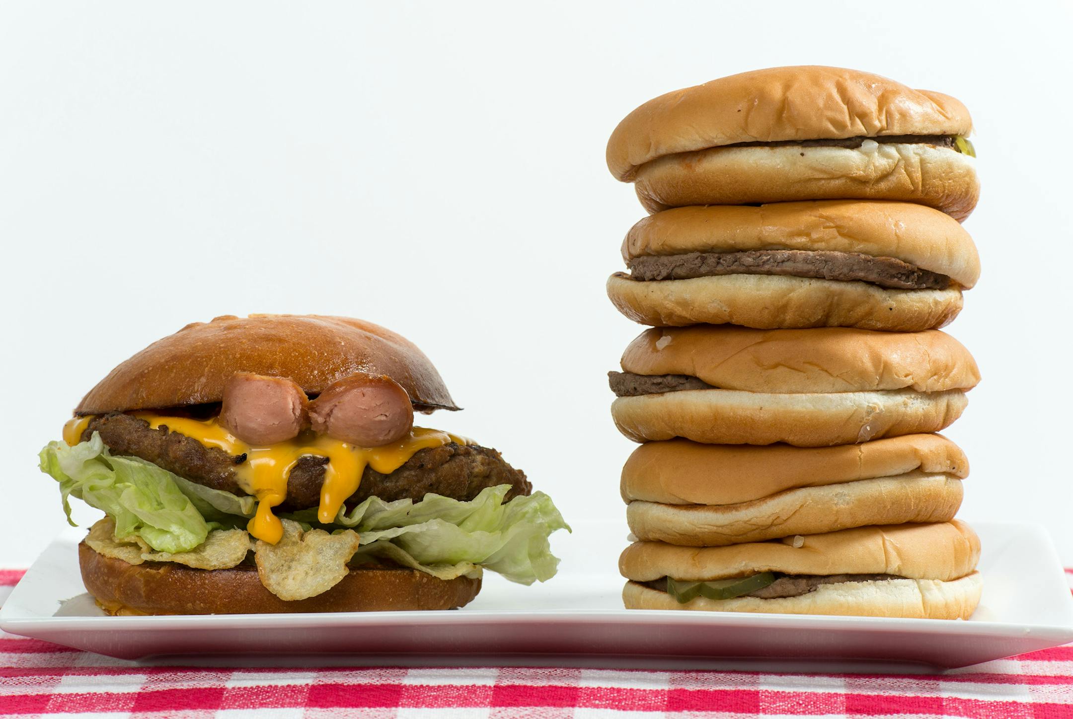 The 1/2 lb. Most American Thickburger from Carl's Jr., left, is comparable in calories to five hamburgers from McDonald's, right. (Lezlie Sterling/Sacramento Bee/TNS) ORG XMIT: 1171813