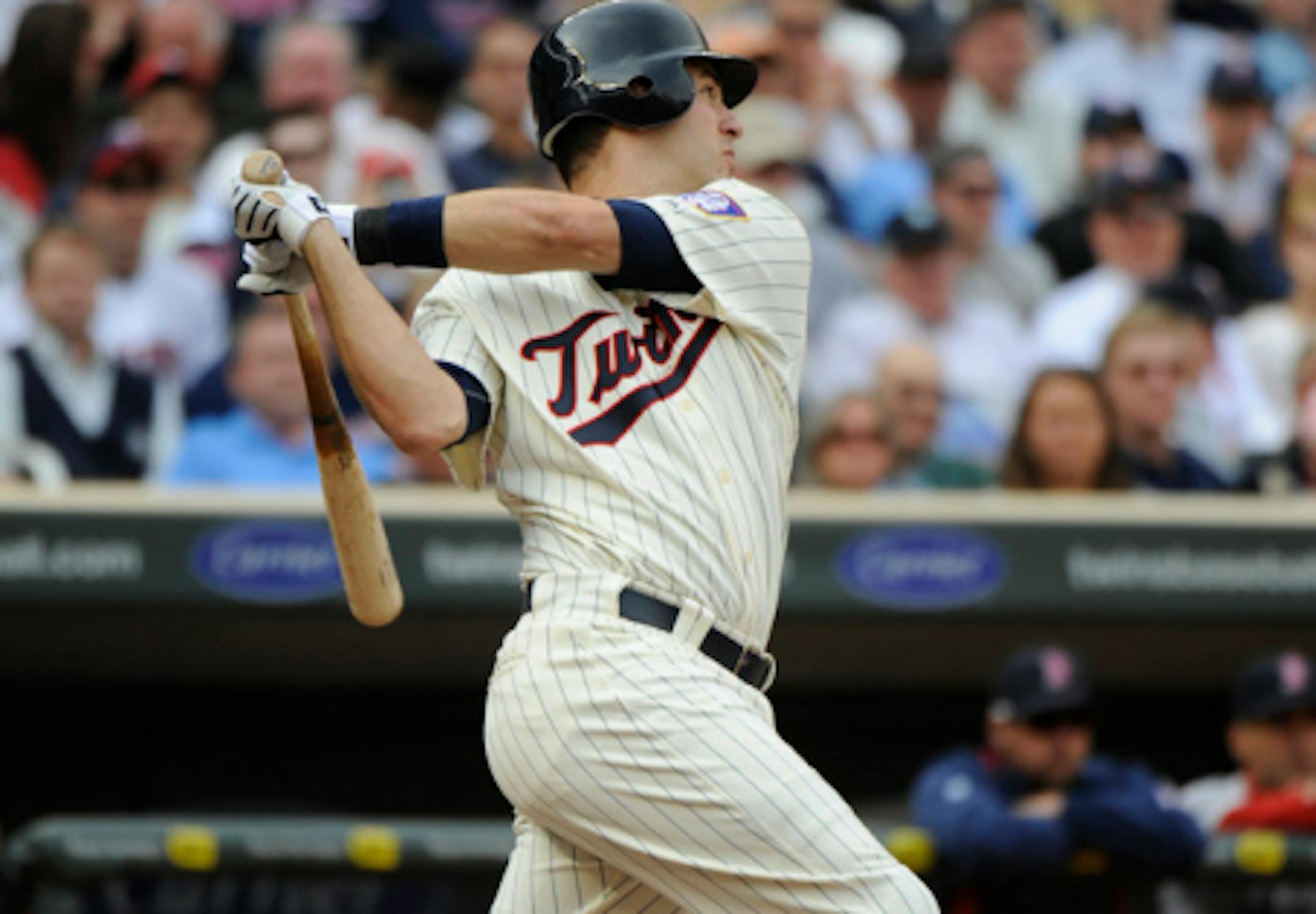 MINNESOTA, MN - APRIL 12: Joe Mauer #7 of the Minnesota Twins hits an RBI double in the second inning against the Boston Red Sox during the Twins home opener at Target Field on April 12, 2010 in Minneapolis, Minnesota. (Photo by Hannah Foslien /Getty Images)