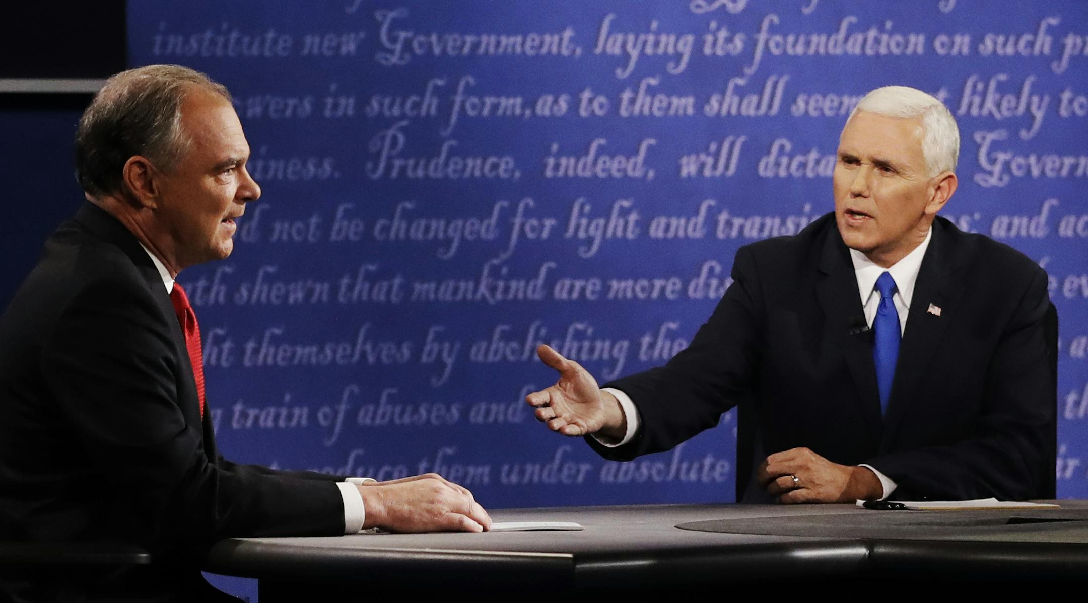 Republican vice-presidential nominee Gov. Mike Pence speaks with Democratic vice-presidential nominee Sen. Tim Kaine during the vice-presidential debate at Longwood University in Farmville, Va., Tuesday, Oct. 4, 2016. (AP Photo/Patrick Semansky) ORG XMIT: MIN2016100511322333