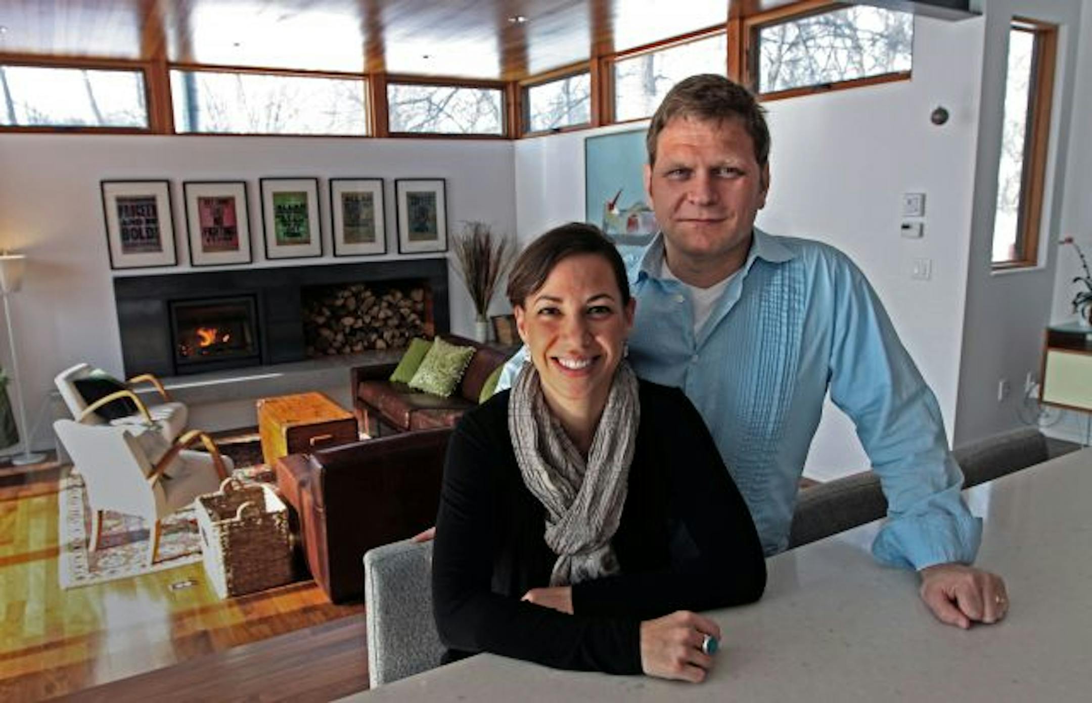Shelley and Trent Gilliss, photographed in the kitchen-living room area of their home.