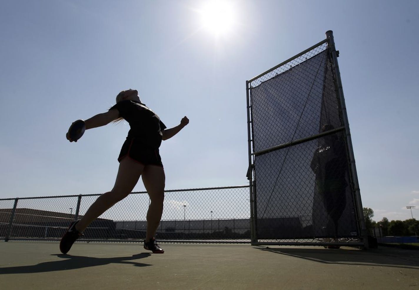 St. Francis junior Maggie Ewen, shown here at practice last month, broke a state meet record Friday with a discus throw of 171-9. She set the state's all-time mark earlier this spring with a throw of 172-7.