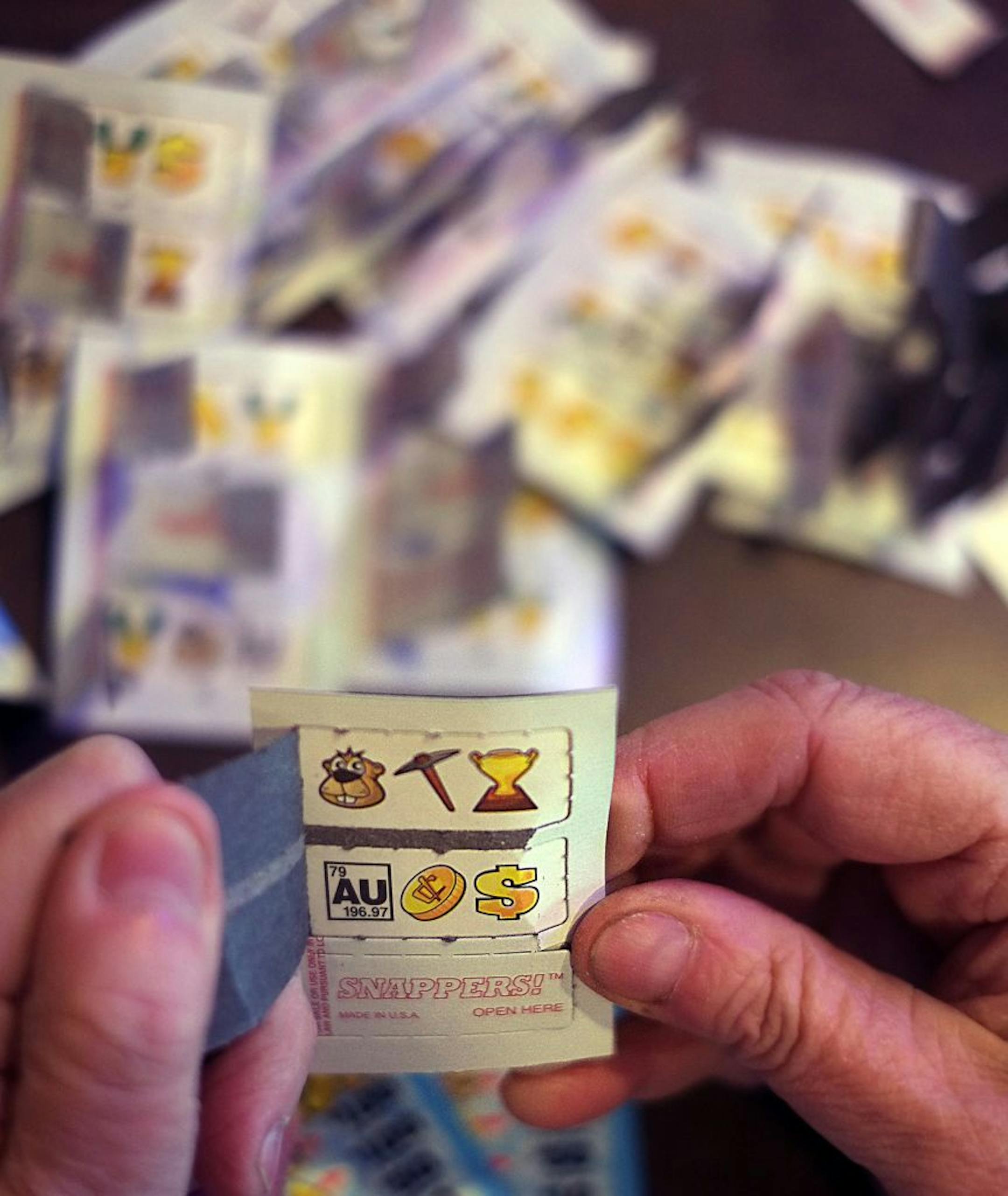 Many different routines are followed when opening paper pulltabs, depending on players' superstitions.