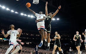 UConn guard Hassan Diarra (10) shoots past Purdue guard Myles Colvin during the second half of the NCAA college Final Four championship basketball gam