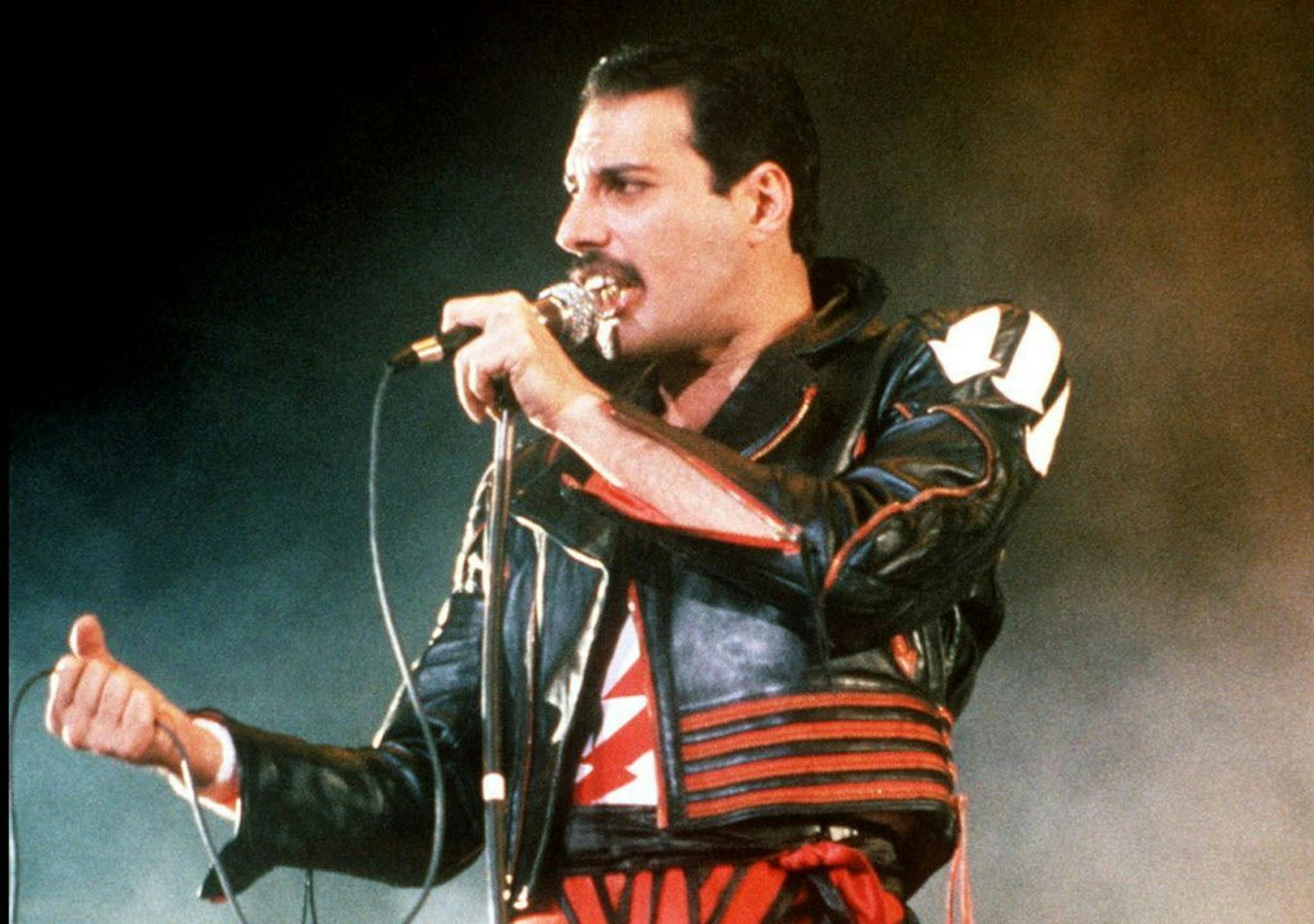 FILE - In this 1985 file photo, singer Freddie Mercury of the rock group Queen, performs at a concert in Sydney, Australia. Queen guitarist Brian May says an asteroid in Jupiter's orbit has been named after the band's late frontman Freddie Mercury on what would have been his 70th birthday, it was reported on Monday, Sept. 5, 2016. May says the International Astronomical Union's Minor Planet Centre has designated an asteroid discovered in 1991, the year of Mercury's death, as "Asteroid 17473 Fred