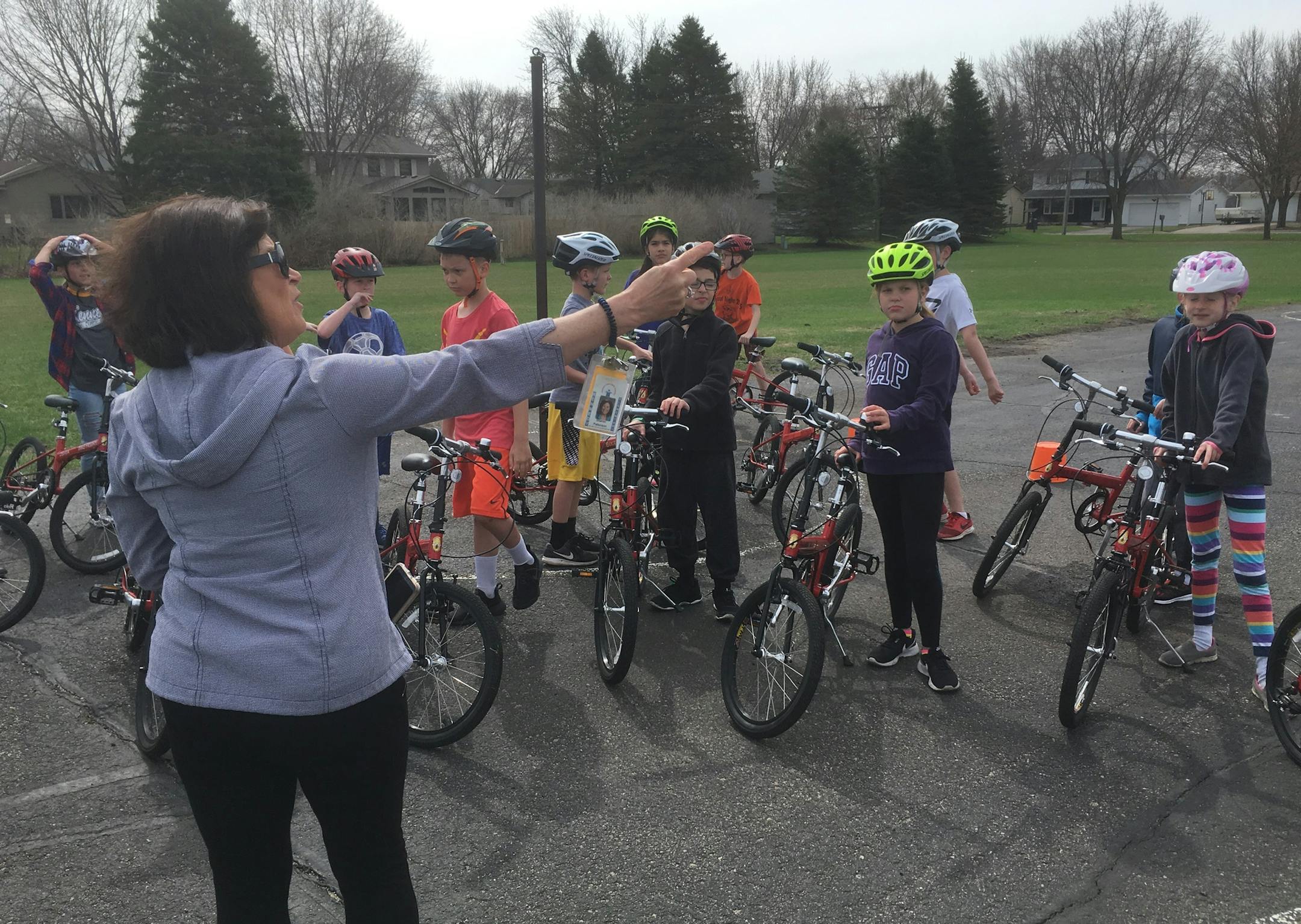 Sharon Patterson, a gym teacher at Kennedy Elementary School in Mankato, gets her fourth-graders organized for a bike safety class.
