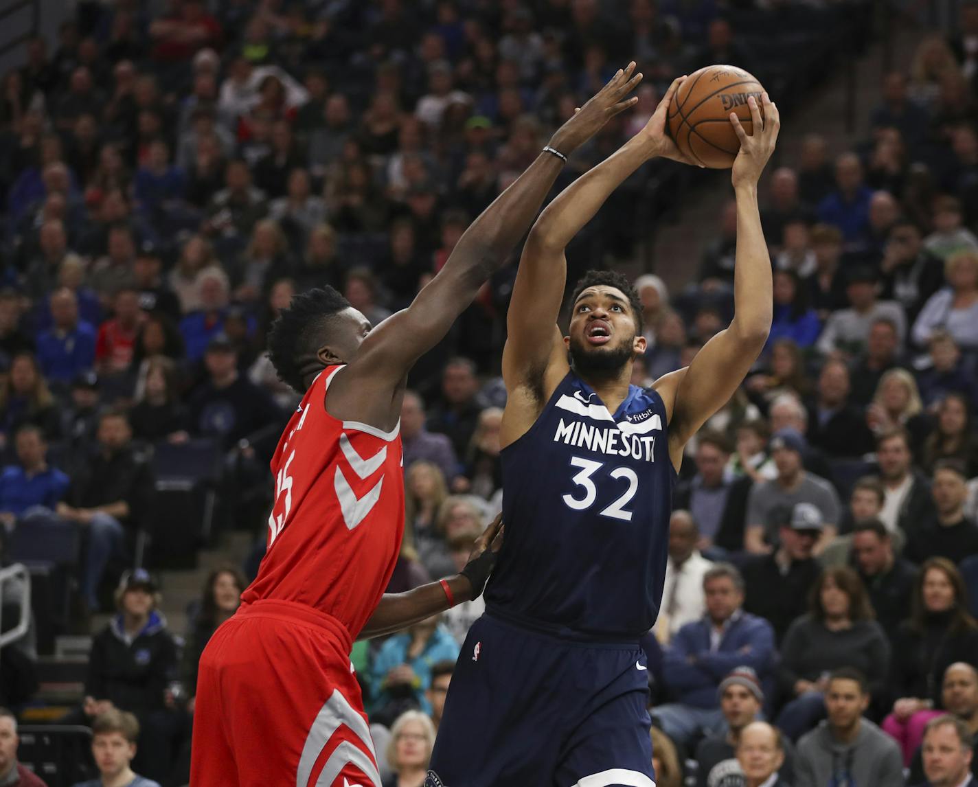 Minnesota Timberwolves center Karl-Anthony Towns (32) tried to shoot around the defense of Houston Rockets center Clint Capela (15) in the first quarter. ] JEFF WHEELER &#xef; jeff.wheeler@startribune.com The Minnesota Timberwolves faced the Houston Rockets in an NBA basketball game Sunday night, March 18, 2018 at Target Center in Minneapolis.