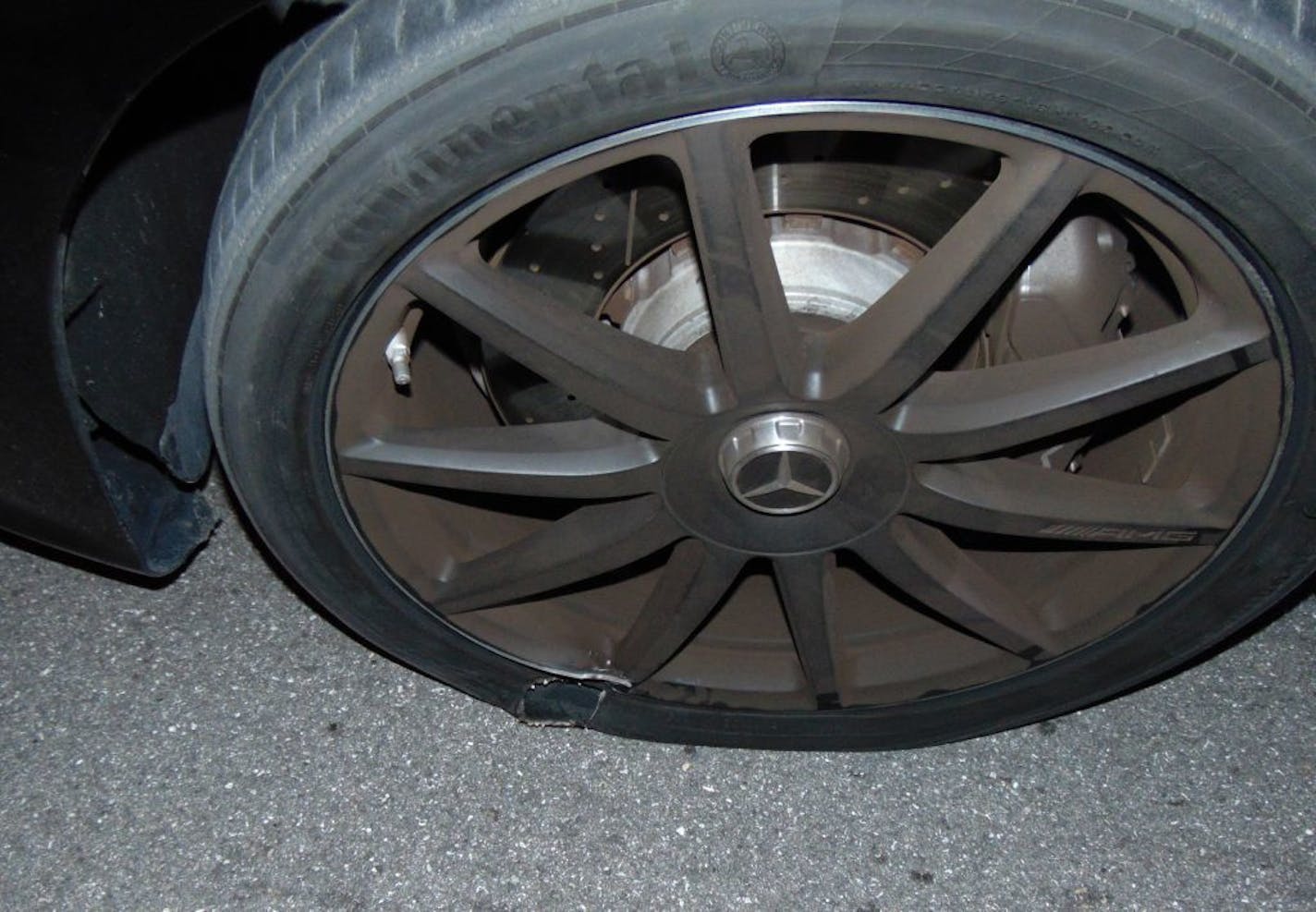 This Monday, May 29, 2017, photo provided by the Jupiter Police Department shows a flat tire of Tiger Woods' car after police found Woods sound asleep behind the wheel of his car parked on the side of a road in Jupiter, Fla. Woods was arrested on suspicion of driving under the influence, but issued a statement nearly 10 hours after he was released from jail on Monday that alcohol was not involved.