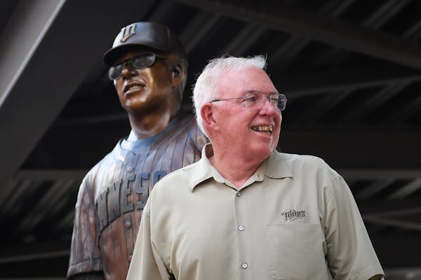 Tom Kelly stood in front of his just-unveiled statue during its unveiling ceremony Friday.