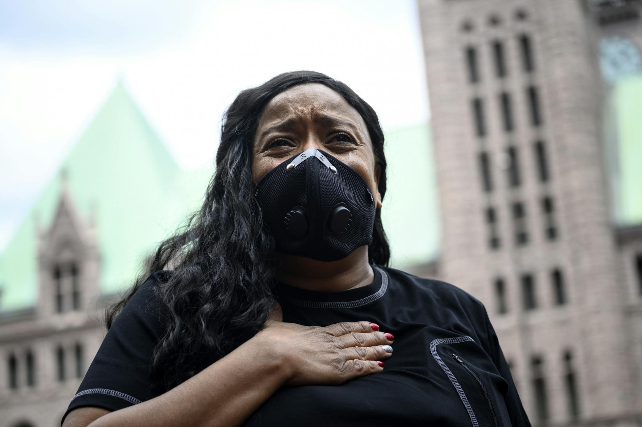 Tears streamed down the face of Felicia Johnson, of St. Paul as she was overcome with grief during the reading of names of people killed by police Saturday outside the Hennepin County Government Center. "I am tired of being sick and tired," said Johnson. "I'm here to stand for truth. I'm here to stand for justice. I'm here to stand for Righteousness."