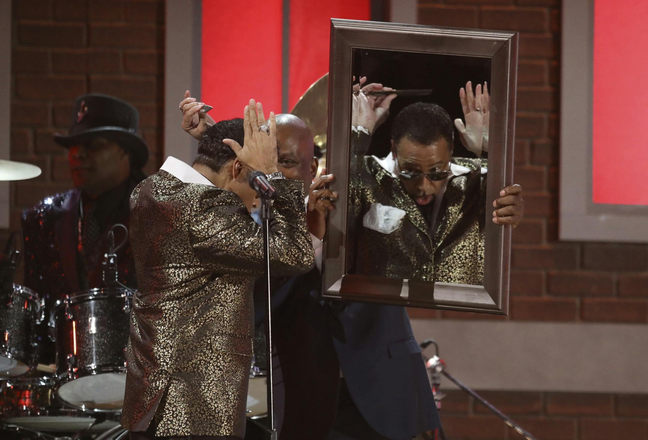 Morris Day of The Time performs a tribute to Prince at the 59th annual Grammy Awards.