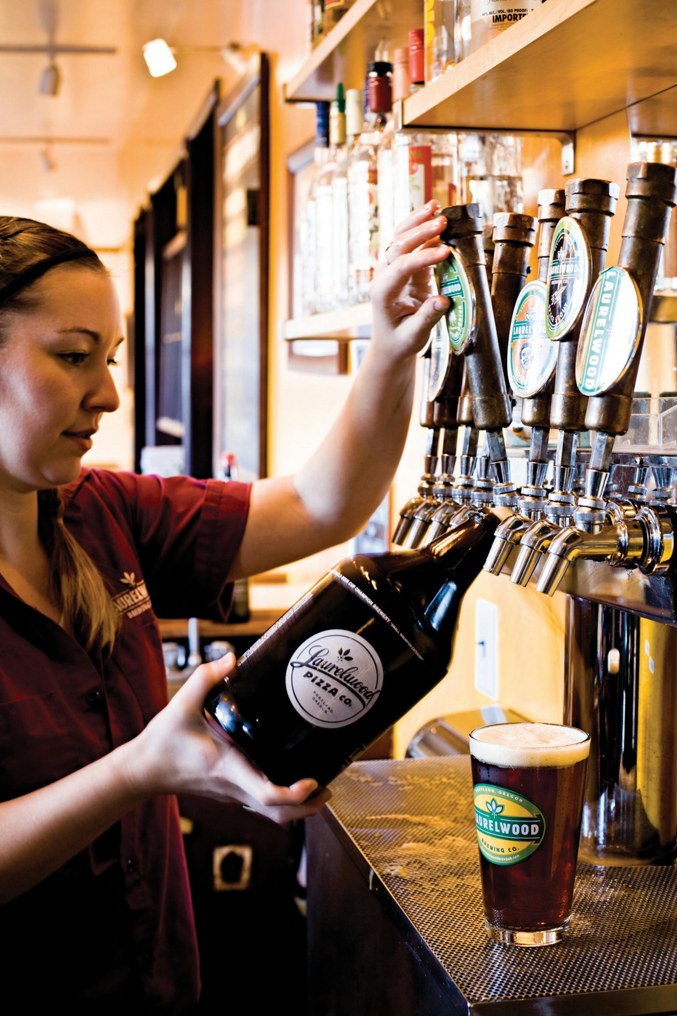 A beer growler is filled at the Laurelwood Public House in Portland, OR