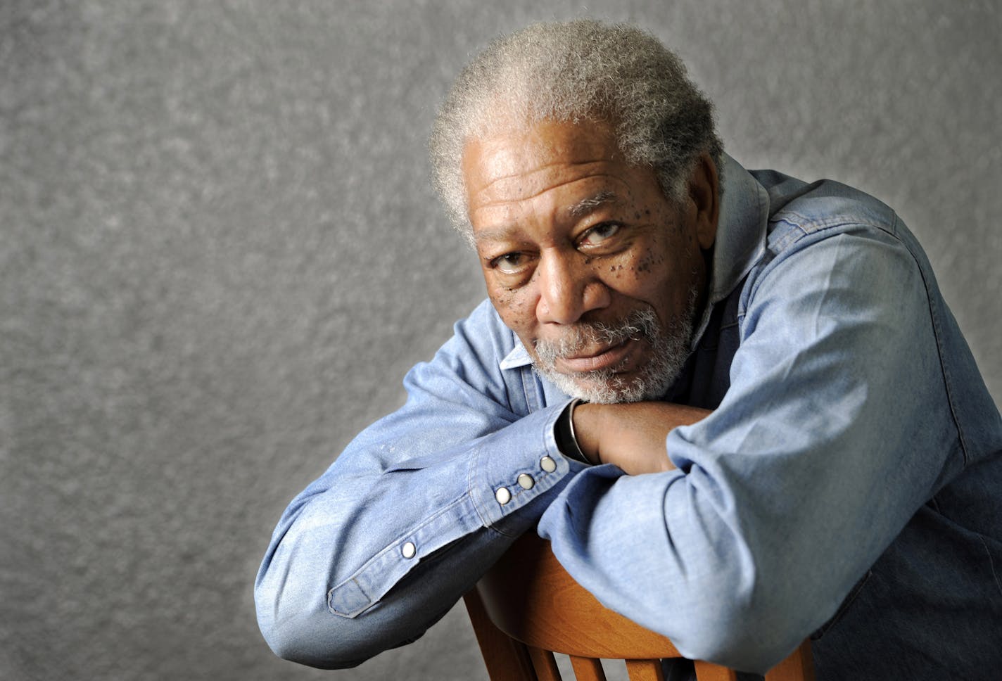 FILE - In this April 25, 2011 file photo, actor Morgan Freeman poses for a portrait in Los Angeles. Freeman will receive the Ceceil B. DeMille Award for lifetime achievement at the Golden Globes ceremony on Jan. 15, 2011. (AP Photo/Chris Pizzello, file) ORG XMIT: MIN2013021414512182