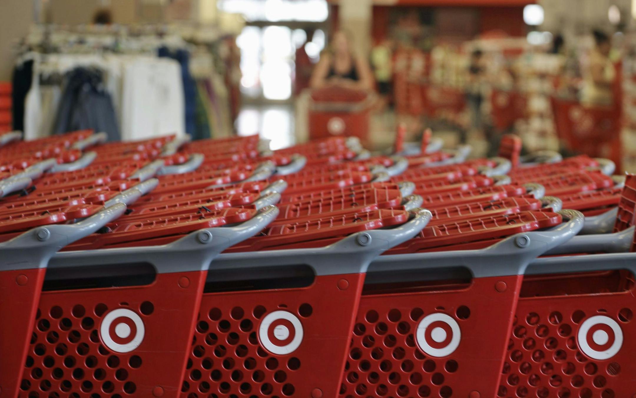 FILE- In this Thursday, July 5, 2012, file photo, rows of carts await customers at a Target store in Chicago. Discount retailer Target Corp. said Thursday, Aug. 2, 2012 that a key revenue measure rose more than expected in July, as more shoppers visited its stores and spent more on their purchases. (AP Photo/M. Spencer Green, File) ORG XMIT: MIN2012081516160828 ORG XMIT: MIN1302271633340217