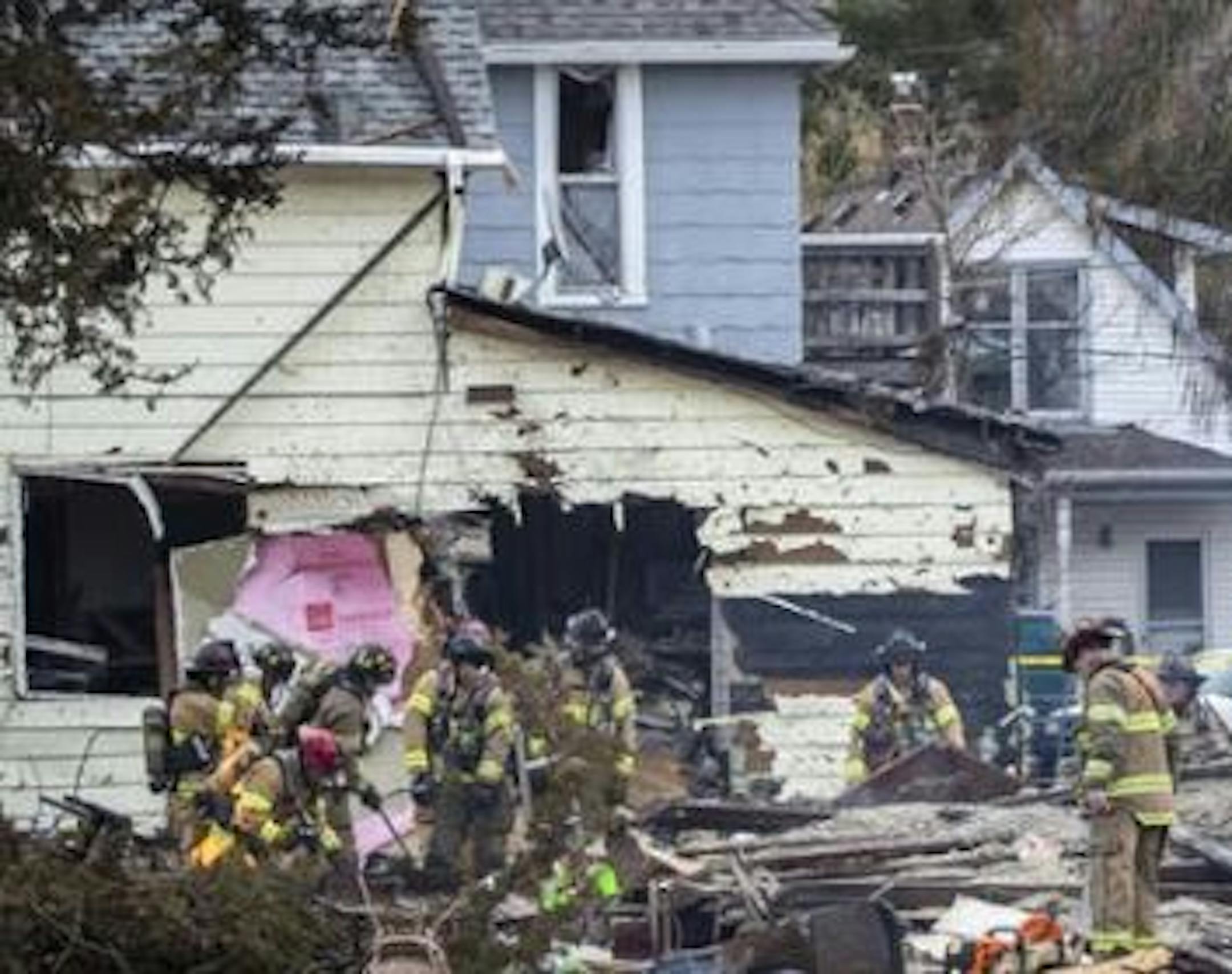 Firefighters worked amid the home explosion scene on Nov. 23 in St. Paul.