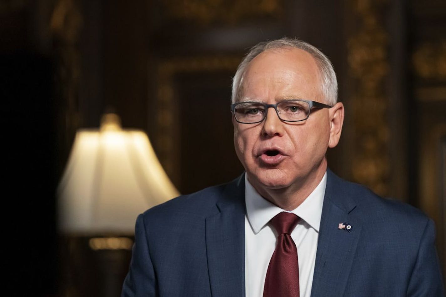 Minnesota Gov. Tim Walz speaks from the Governor's Reception room at the State Capitol, to discuss the latest steps in his response to COVID-19, Wednesday, Nov. 18, 2020, in St. Paul, Minn.