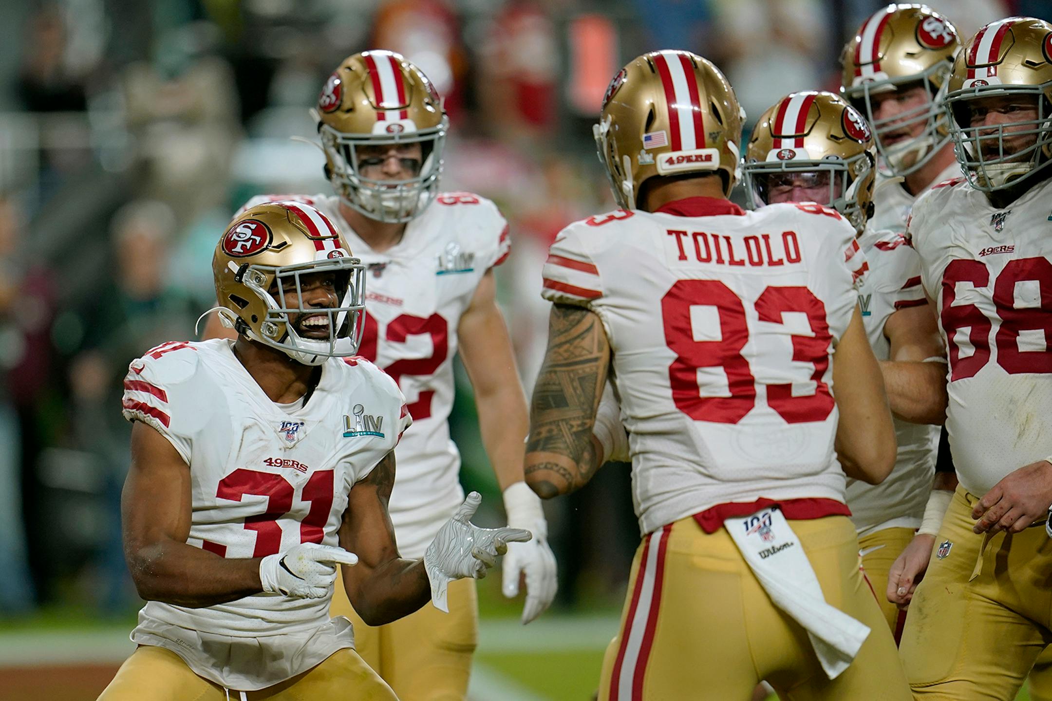 San Francisco 49ers' Raheem Mostert, left, celebrates his touchdown against the Kansas City Chiefs during the second half of the NFL Super Bowl 54 football game Sunday, Feb. 2, 2020, in Miami Gardens, Fla.