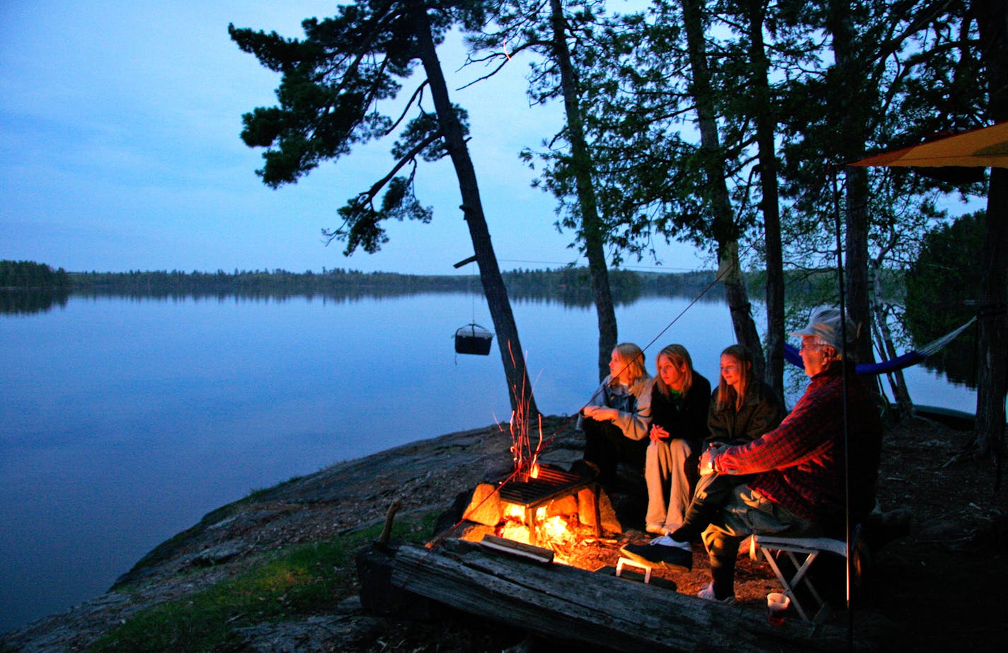 The Big List on camping, from how to pick a tent to homemade canoe packs to glamping and picking the best campsite. Here, Sarah Ozment, Alyssa Chandler, Natalie Peterson with around the Campfire at Lake Three in the BWCA with their grandfather Ken Johnson. ] BRIAN PETERSON &#xef; brian.peterson@startribune.com
BWCA, MN 03/24/17 ORG XMIT: MIN1703241300568886