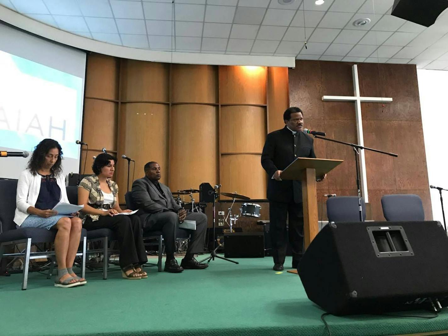 Rev. Billy G. Russell opens up a forum on immigration and incarceration Saturday, Aug. 12 at Greater Friendship Missionary Baptist Church in Minneapolis. The event was organized by the ISAIAH faith-based coalition.