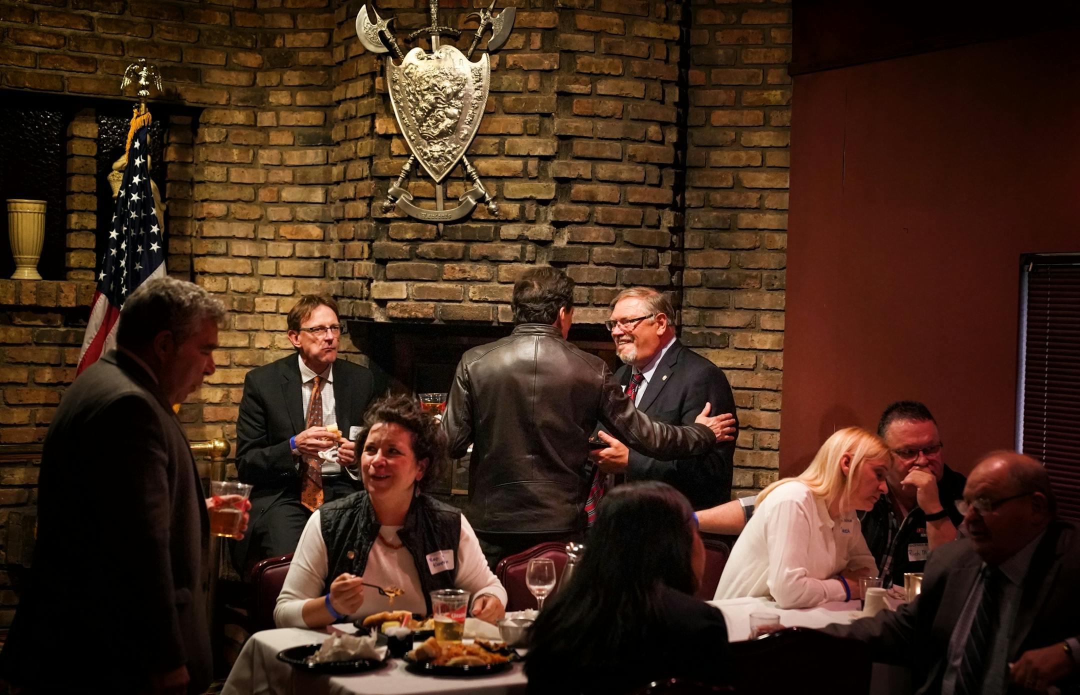 Senator Tom Bakk on the right, talked with guests at the Ranger Party. The biannual Ranger Party was held at Mancini's Char House in St. Paul. On the left is Iron Range lobbyist Gary Cerkvenik.